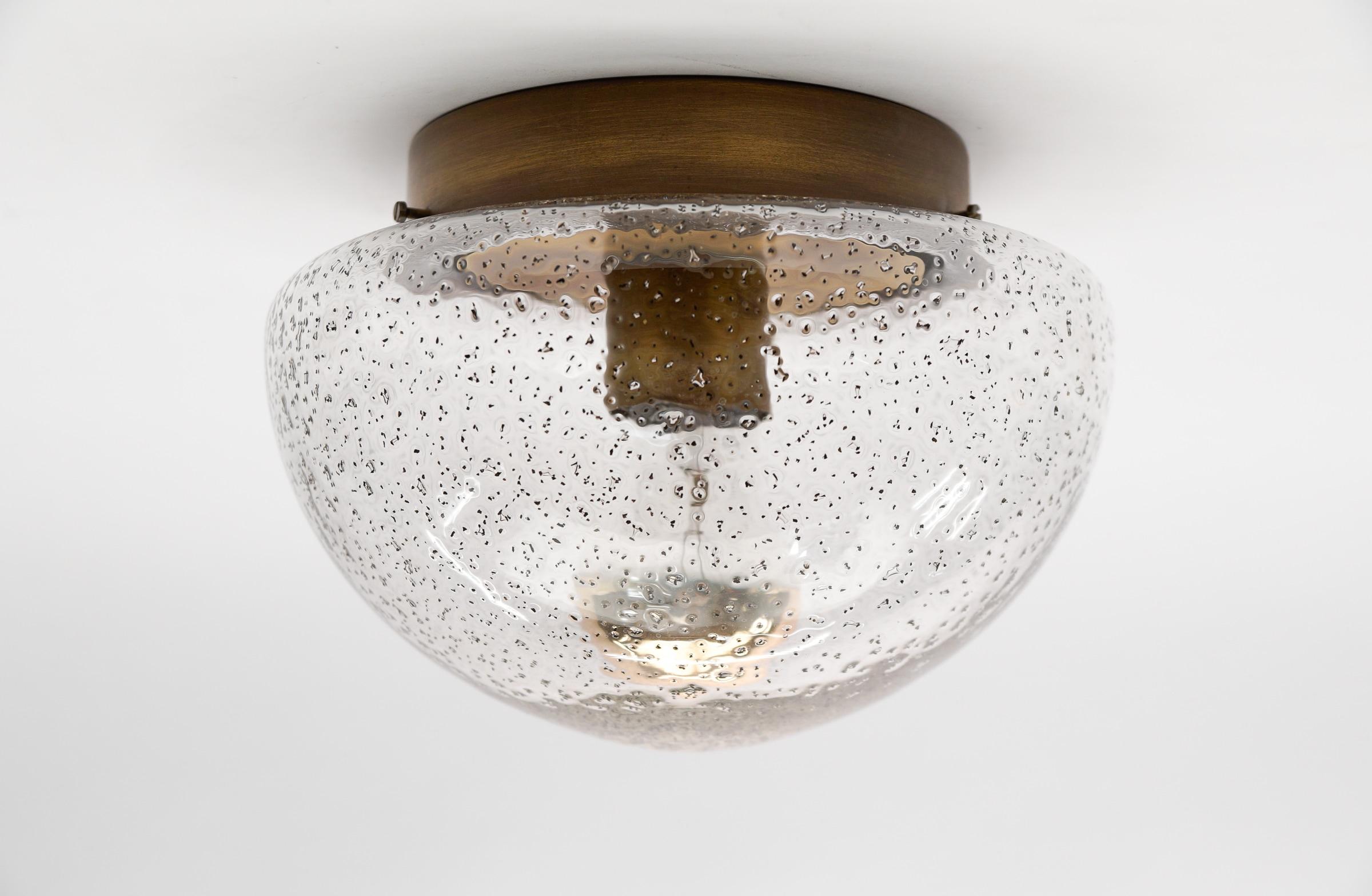 Petite Bronze Mushroom Shaped Glass Lamp, Germany 1960s

Dimensions
Height: 6.29 in. (16 cm)
Diameter: 9.05 in. (23 cm)

The fixture need 1 x E27 standard bulb with 60W max.

Light bulbs are not included.
It is possible to install this fixture in