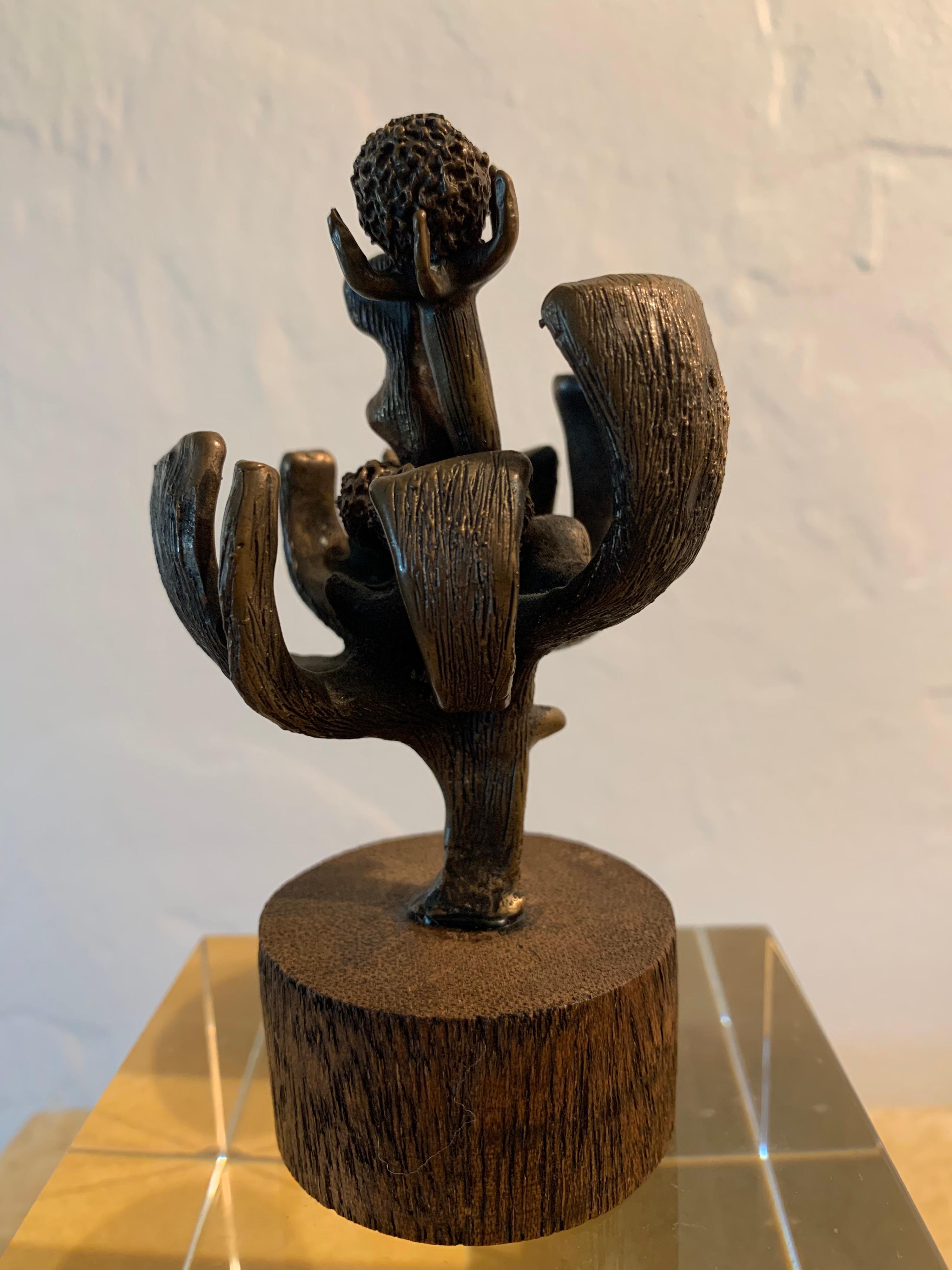 Set on solid zebrawood base, this unknown artist's sculpture can be used as paperweight or desk sculpture. Some markings on base of wood but we cannot determine who made this beauty - All vintage and heavy.