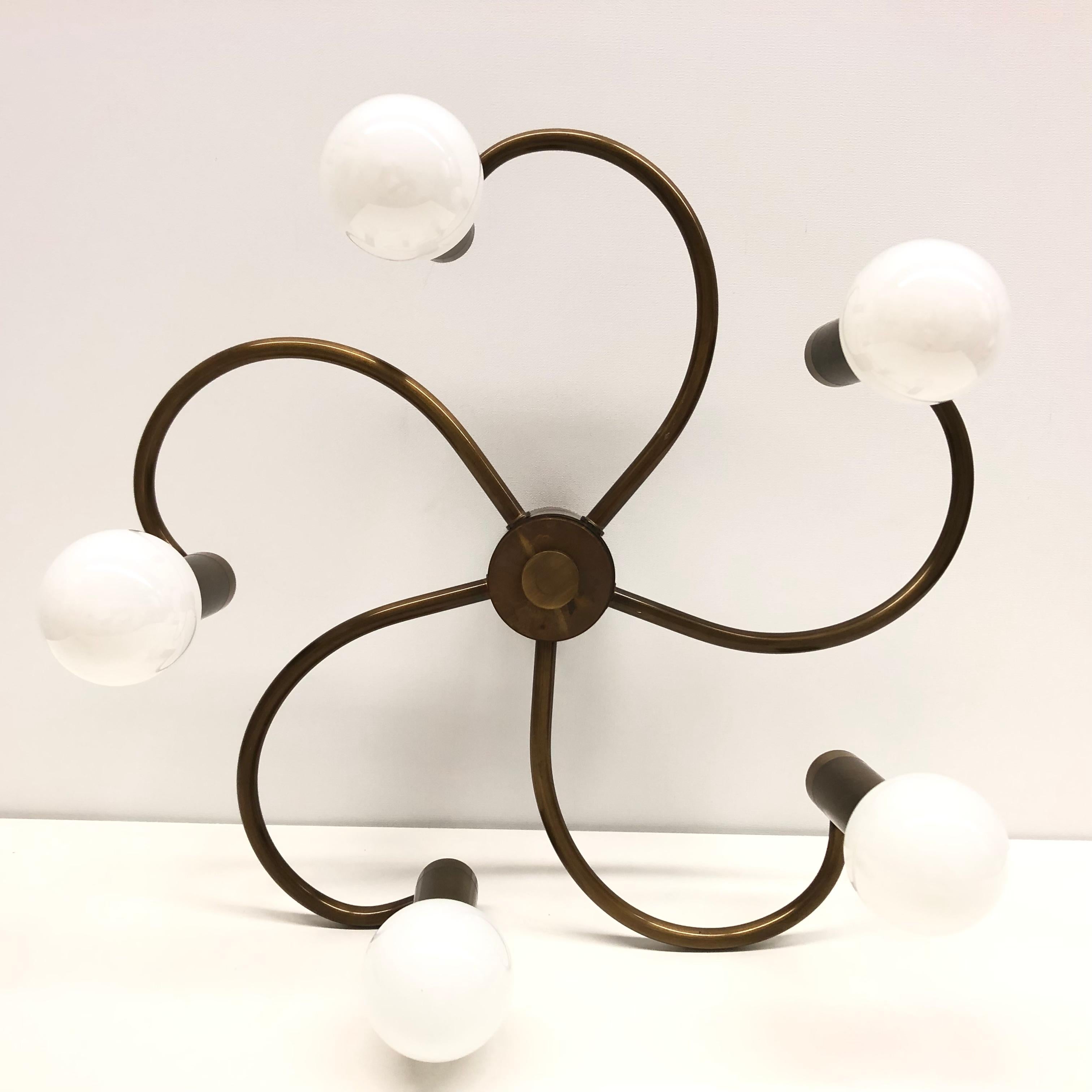 A gorgeous bronzed metal flush mount by Leola Leuchten. It can be used also as a sconce. The light fixture requires five European E14 candelabra bulbs, each up to 60 watts. It measures approx. 6 1/8