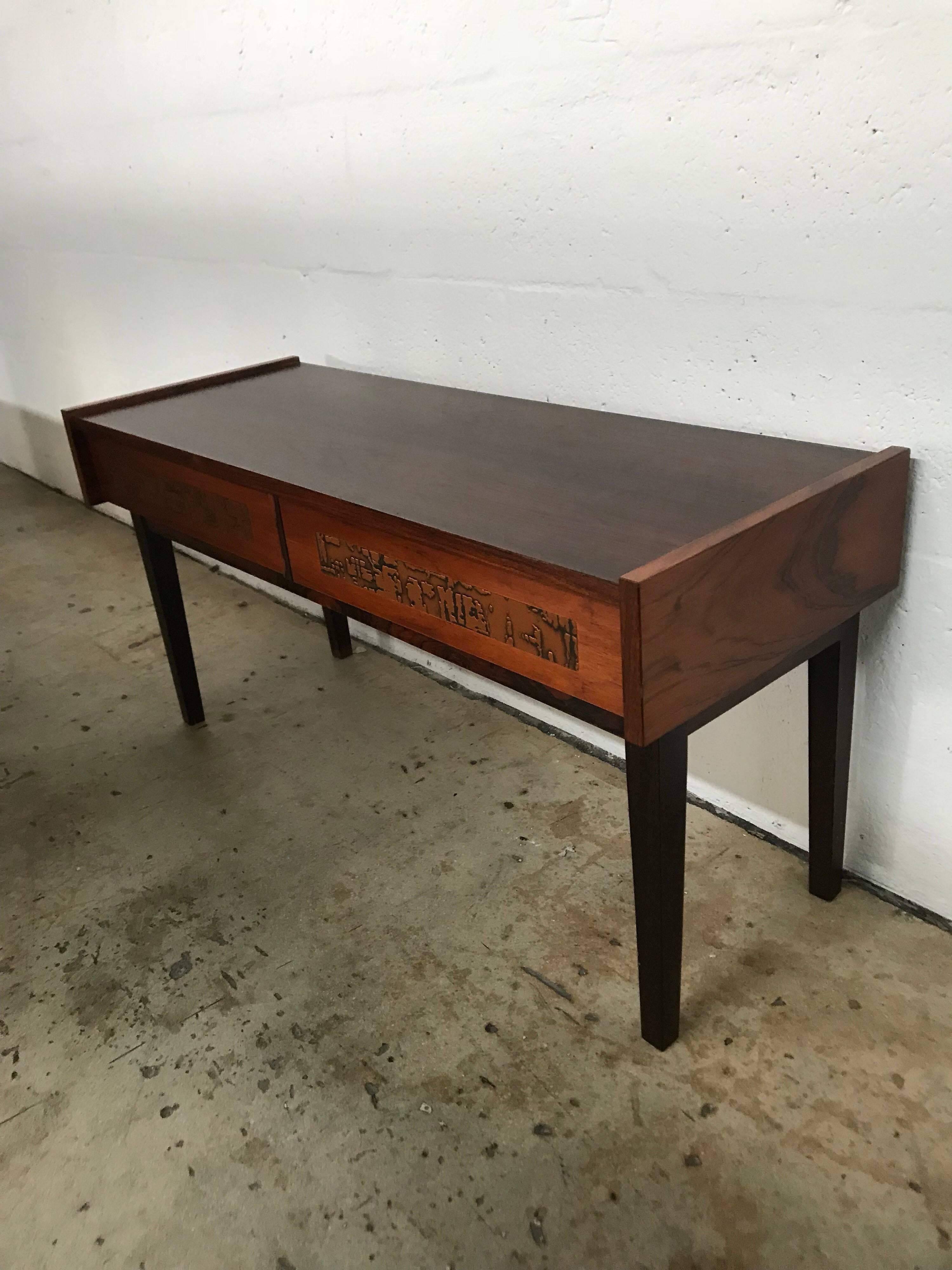 Console table rendered in rosewood and walnut with copper Brutalist drawer fronts, two drawers.