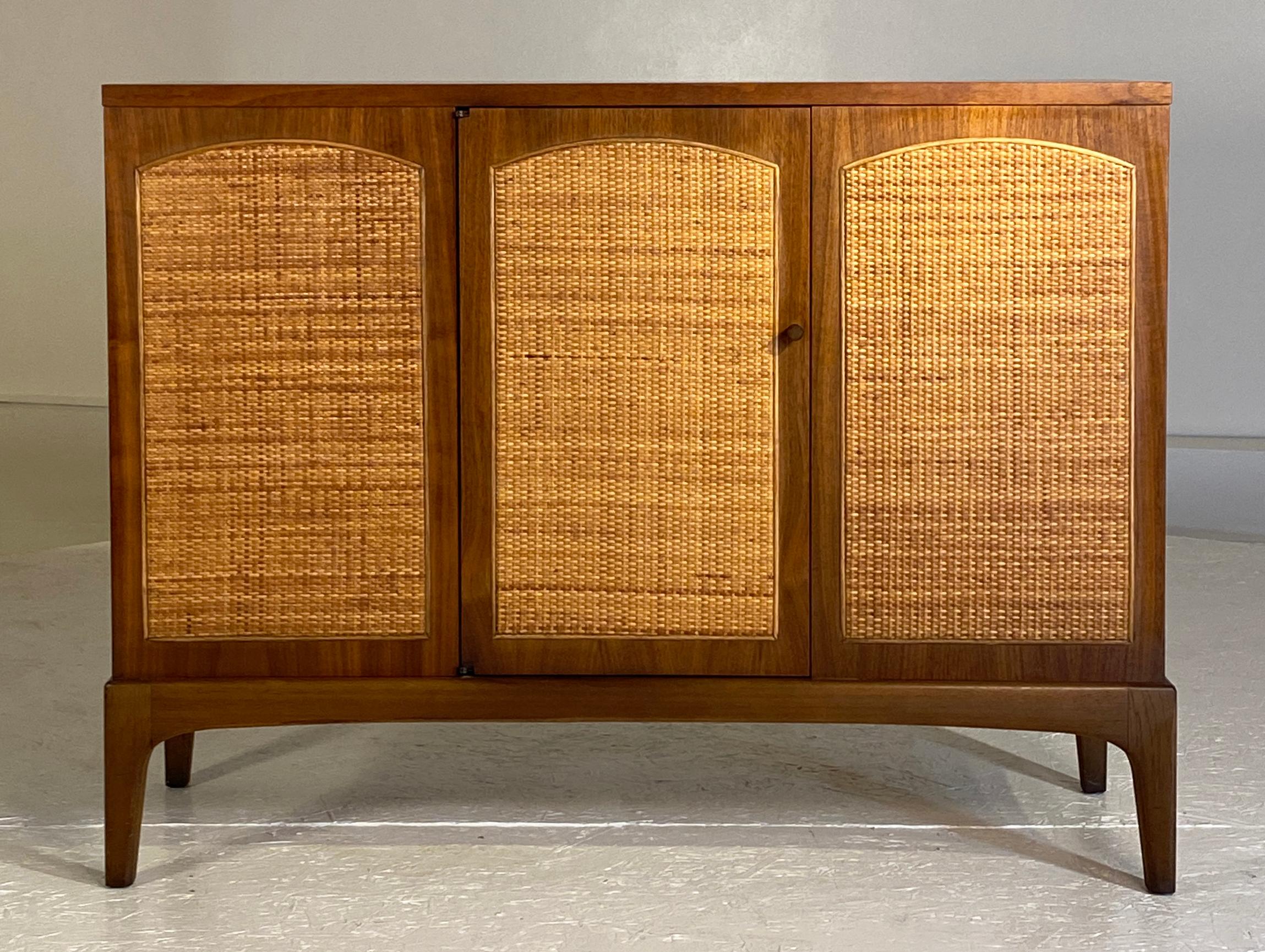 Lane Alta Vista Rhythm Series. This diminutive cabinet is a pleasure to own and has the original finish in excellent condition. A single door in the center opens to reveal storage space including a fixed shelf on center. Beautiful walnut