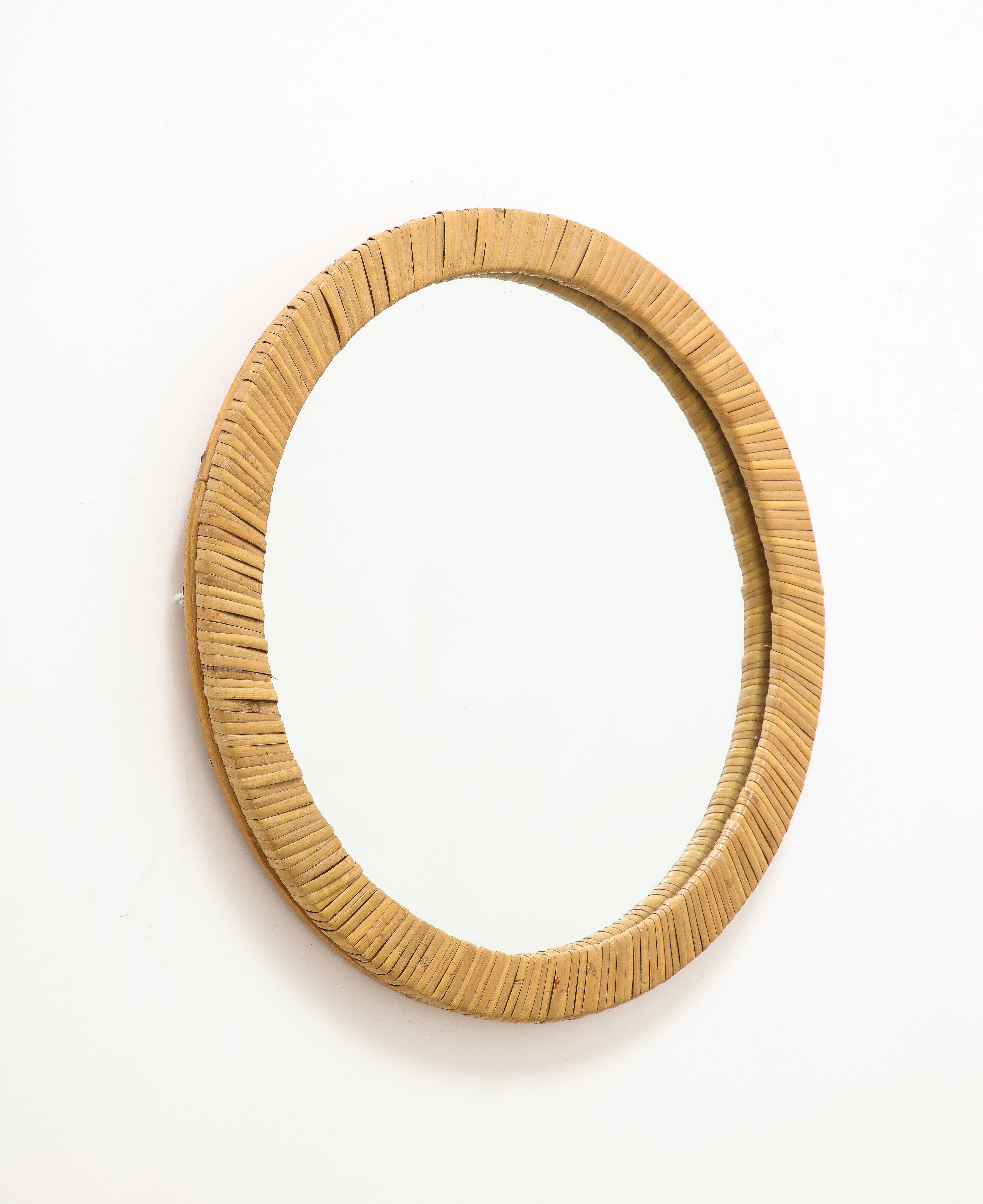 Petite round rattan wall mirror. Italy 1960's. In the style of Can'Tu
