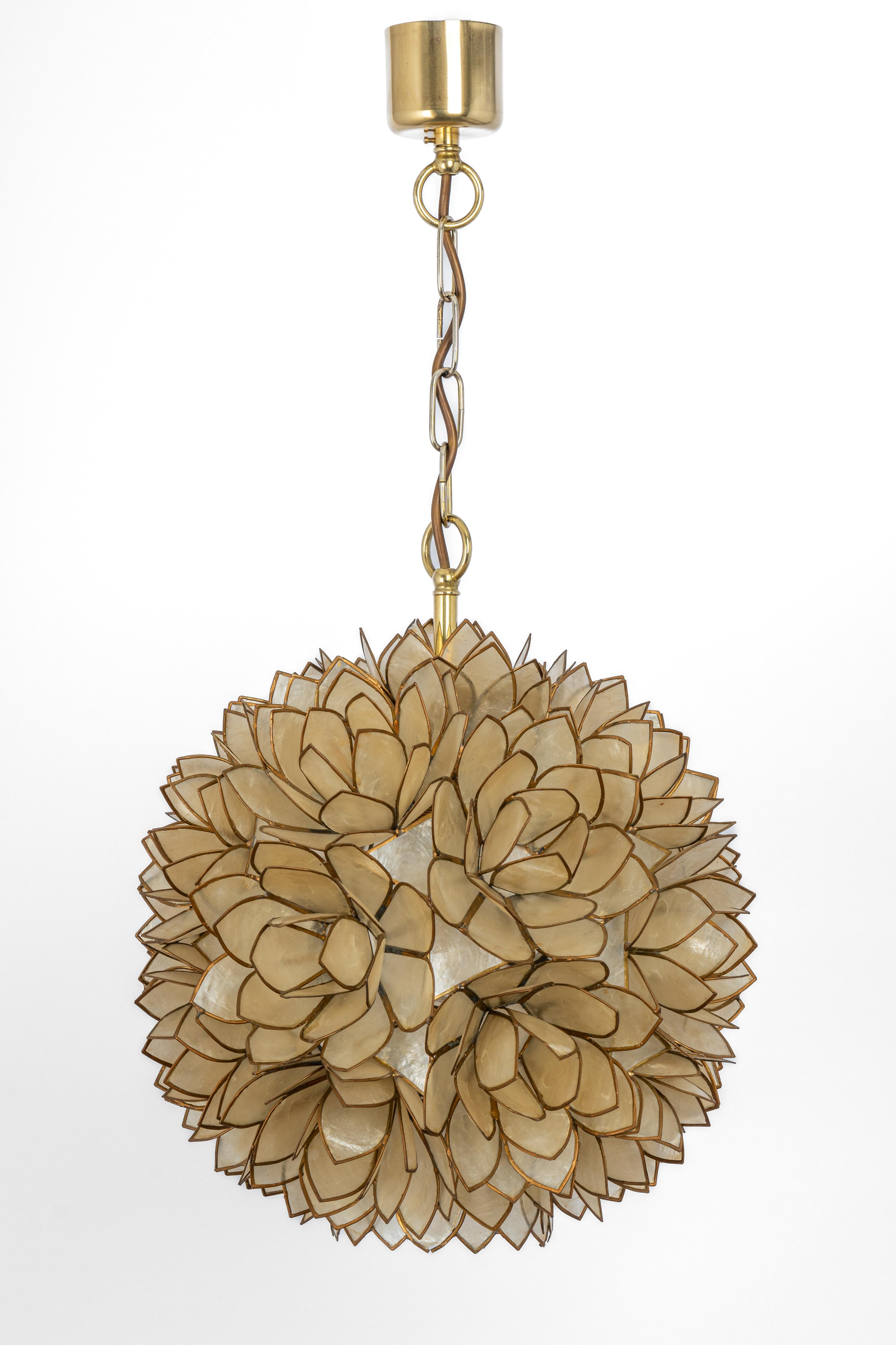 Stunning Capiz shell Lotus ball chandelier pendant light Germany, 1960s

It requires 1 x E27 standard bulbs with 100W max each.
A light bulb is not included. It is possible to install this fixture in all countries (US, UK, Europe, Asia,