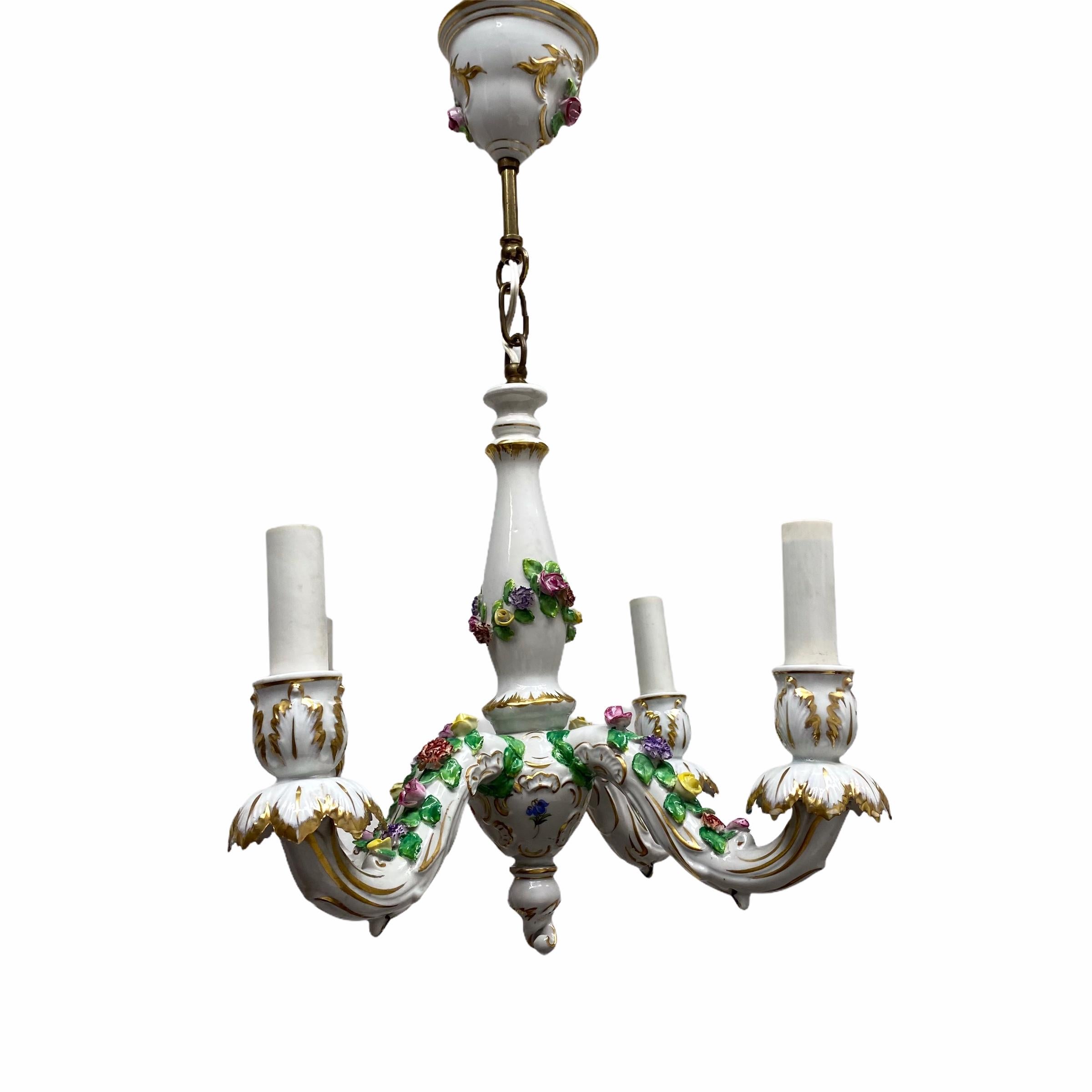 Add a touch of opulence to your home with this charming chandelier! It’s a petite Dresden Porcelain chandelier, to enhance any chic or eclectic home. We'd love to see it hanging in an entryway as a charming welcome home. The fixture requires four