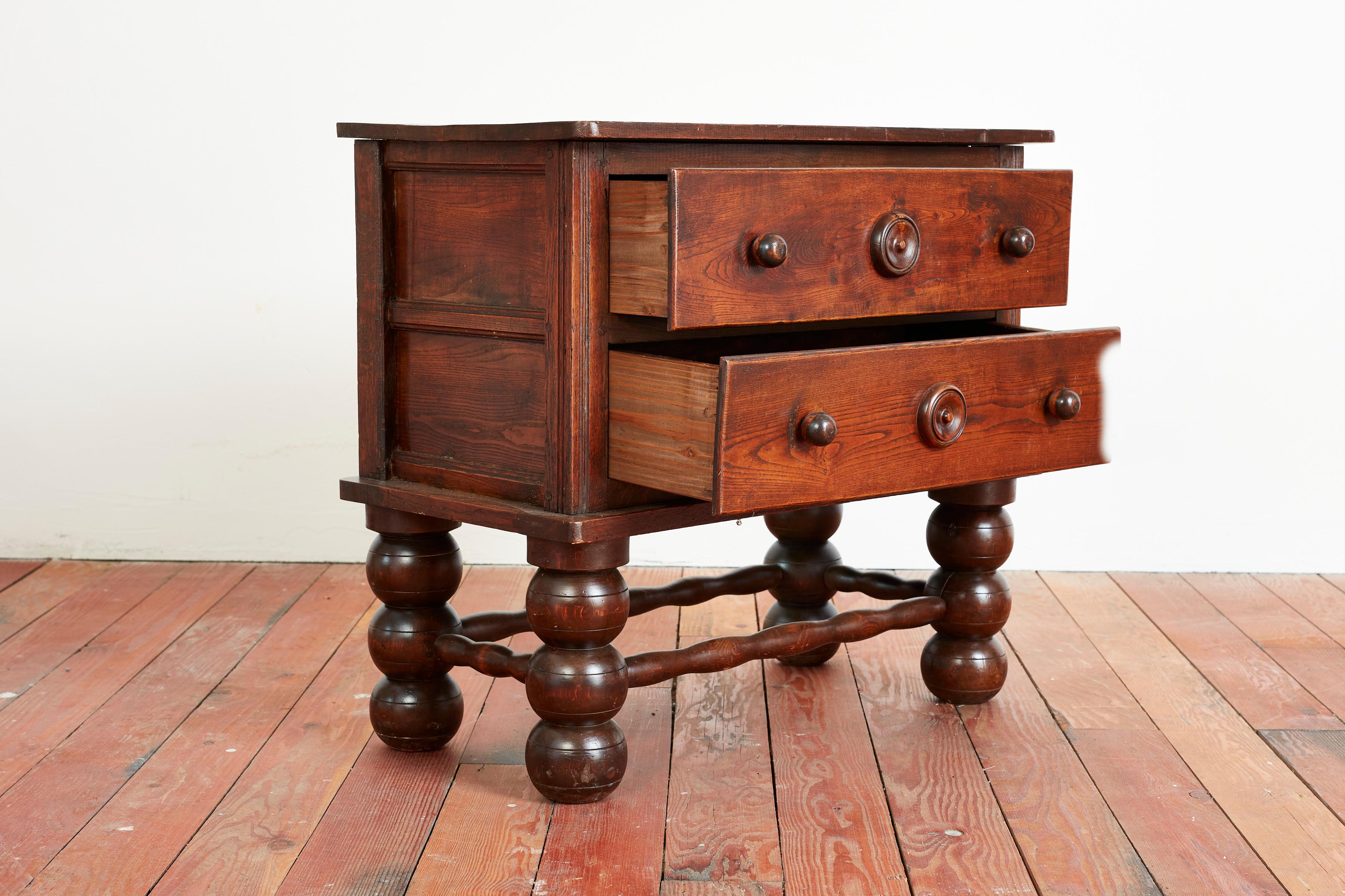 Rare Charles Dudouyt petite sized dresser with 2 drawers, signature bulbous legs and concentric carved circles. 

Rich oak patina with great scale.