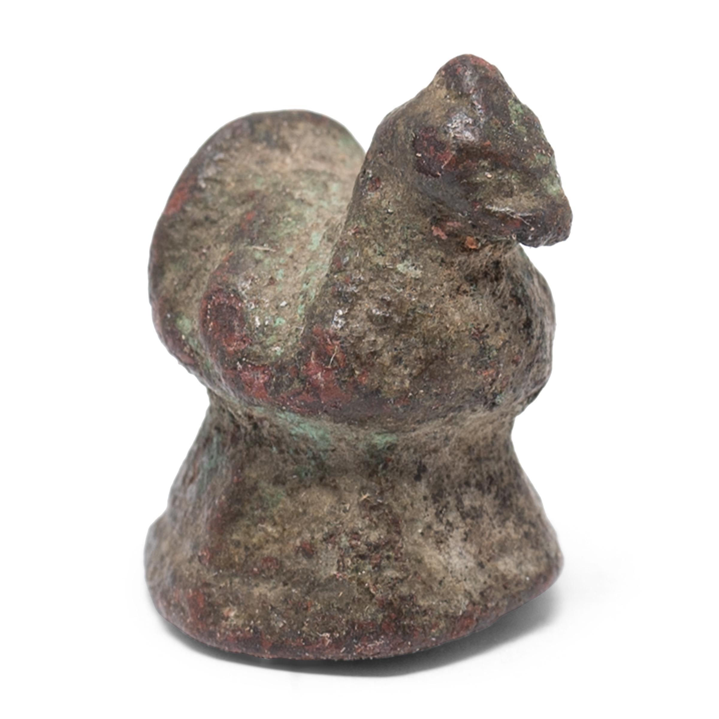 This small figurine was originally used as a counterweight for a tabletop balance, used to parcel out opium, spices, or other valuable goods. The petite weight is cast in bronze in the form of a rooster, the tenth symbolic animal of the Chinese