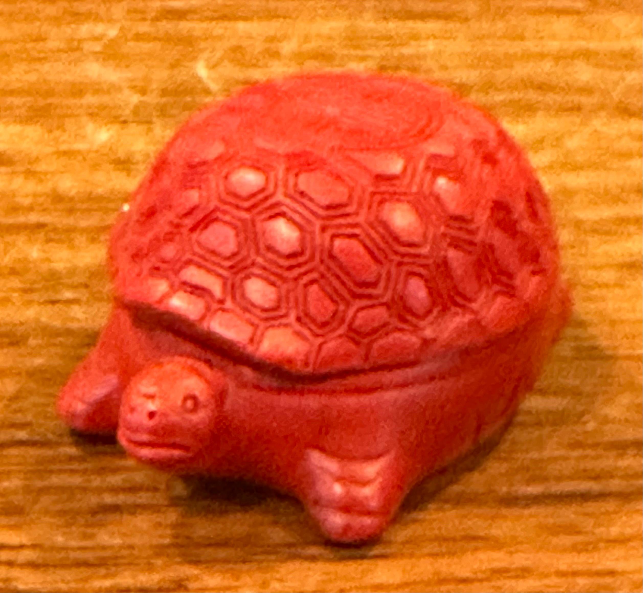 A petite Chinese cinnabar lacquered turtle box, circa 1980's. The box is in very good vintage condition and measures 3.5