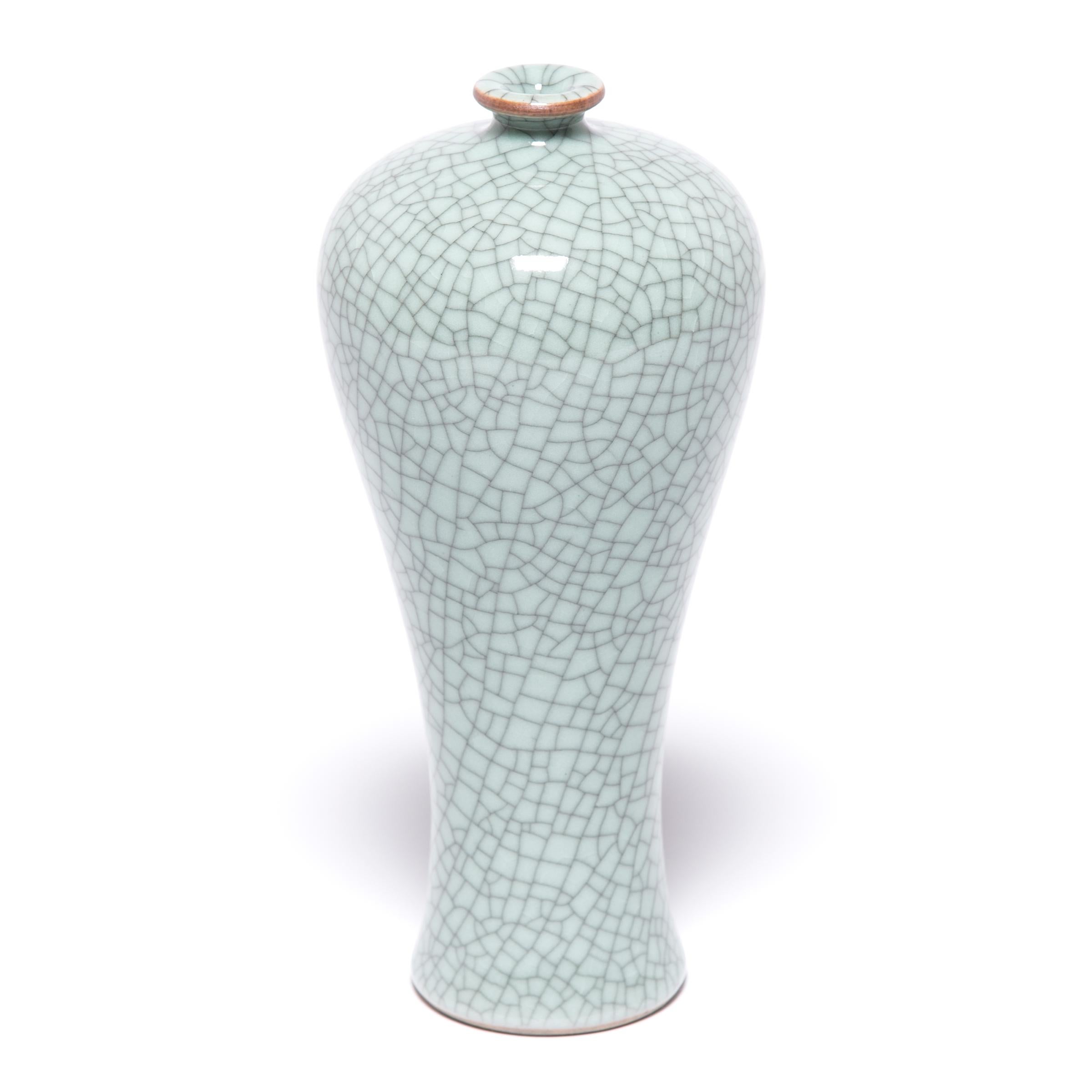This contemporary vase hearkens to the Classic meiping form, traditionally used to display flowering plum branches. Contemporary artisans in Zhejiang beautifully recreate the distinctive crackle glaze of traditional Guan and Ge ware, allowing the
