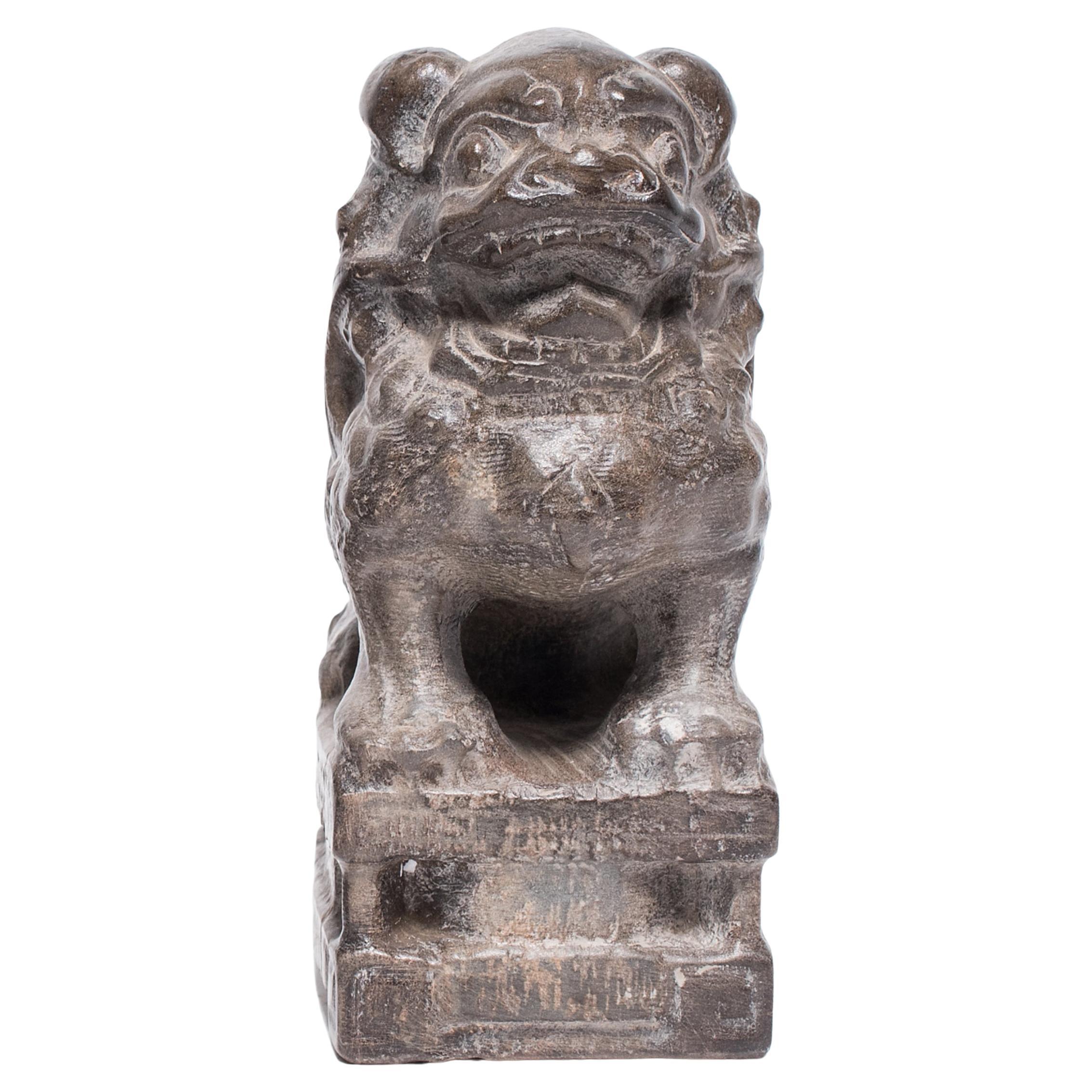 With a curly mane and a lively expression, this petite stone fu dog is an adorable companion and a benevolent guardian of the home. Known as shizi, the mythical dog is thought to offer protection from malevolent spirits and misfortune. A miniature