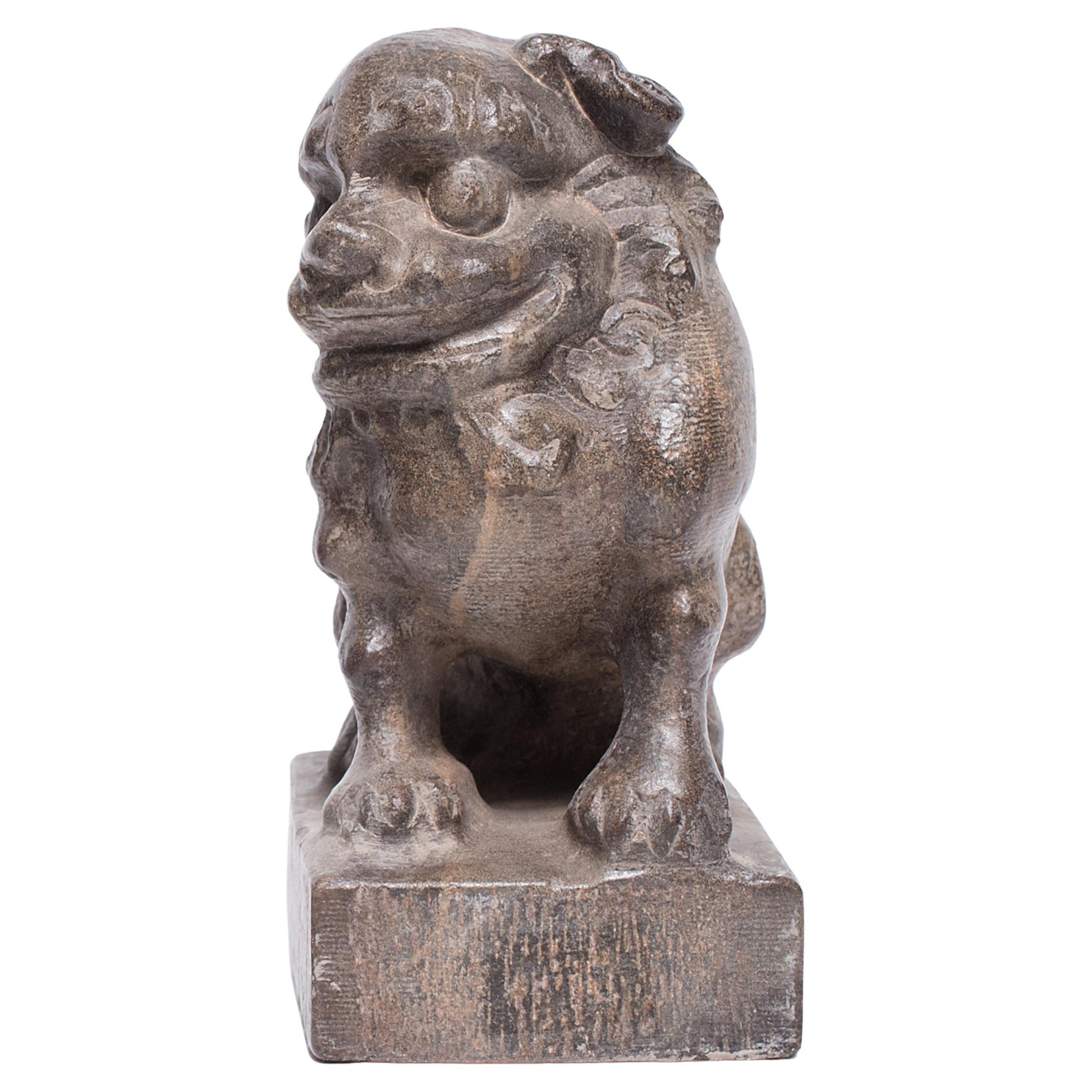 With a curly mane and a lively expression, this petite stone fu dog is an adorable companion and a benevolent guardian of the home. Known as shizi, the mythical dog is thought to offer protection from malevolent spirits and misfortune. A miniature