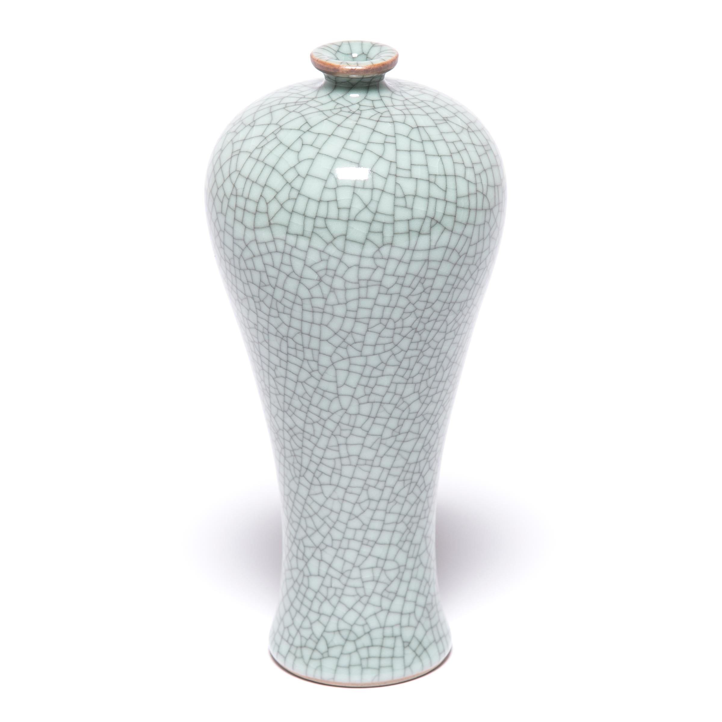 This contemporary vase hearkens back to Classic meiping form, traditionally used to display flowering plum branches. Master ceramic artists in Zhejiang beautifully recreate the distinctive crackle glaze of traditional Guan and Ge ware, allowing a