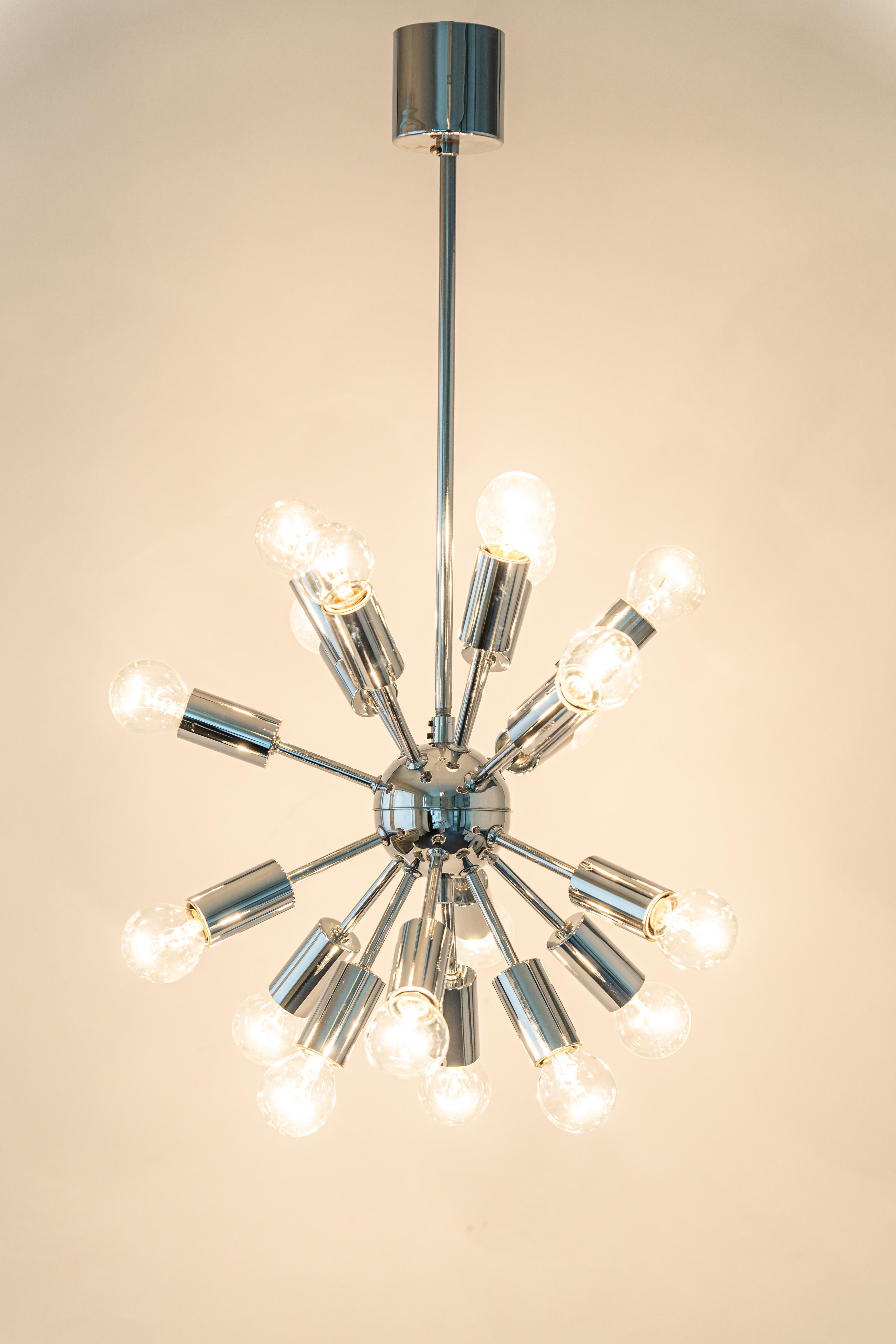 Stunning chrome Sputnik pendant light designed by Cosack during the 1970s.

Sockets: It needs 18 x E14 small bulbs.
Light bulbs are not included. It is possible to install this fixture in all countries (US, UK, Europe, Asia,