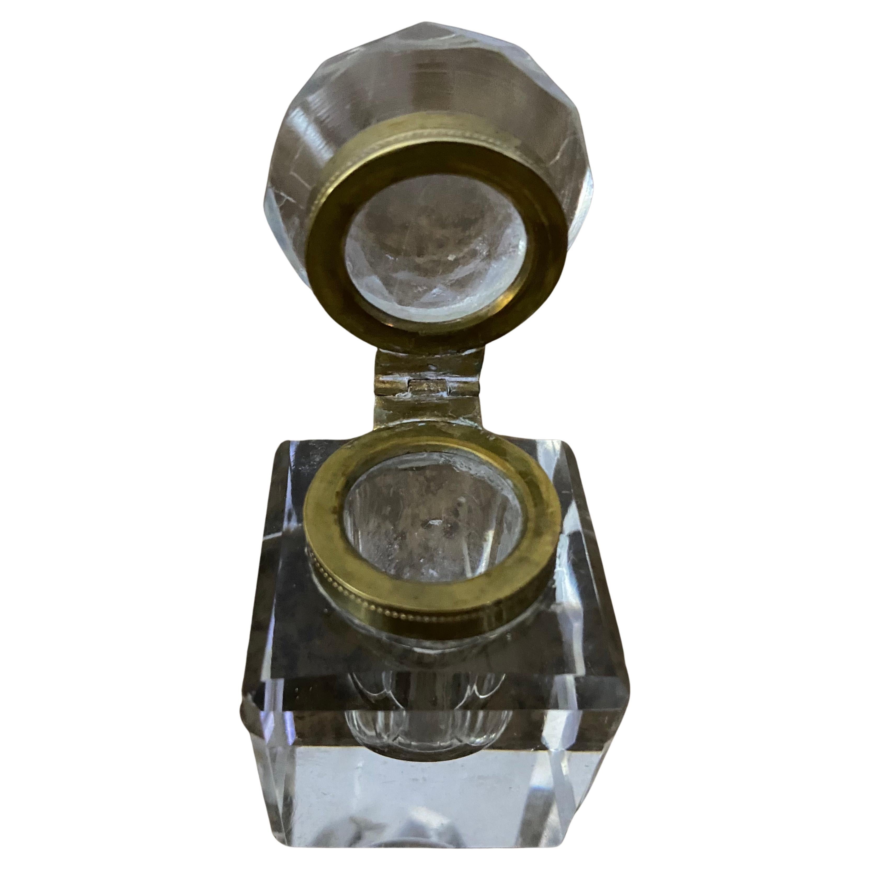 Small and elegant crystal inkwell with a brass collar with a square base and faceted lid makes a wonderful accent on your desk or table top.
Ink-well, ink well, inkwell.