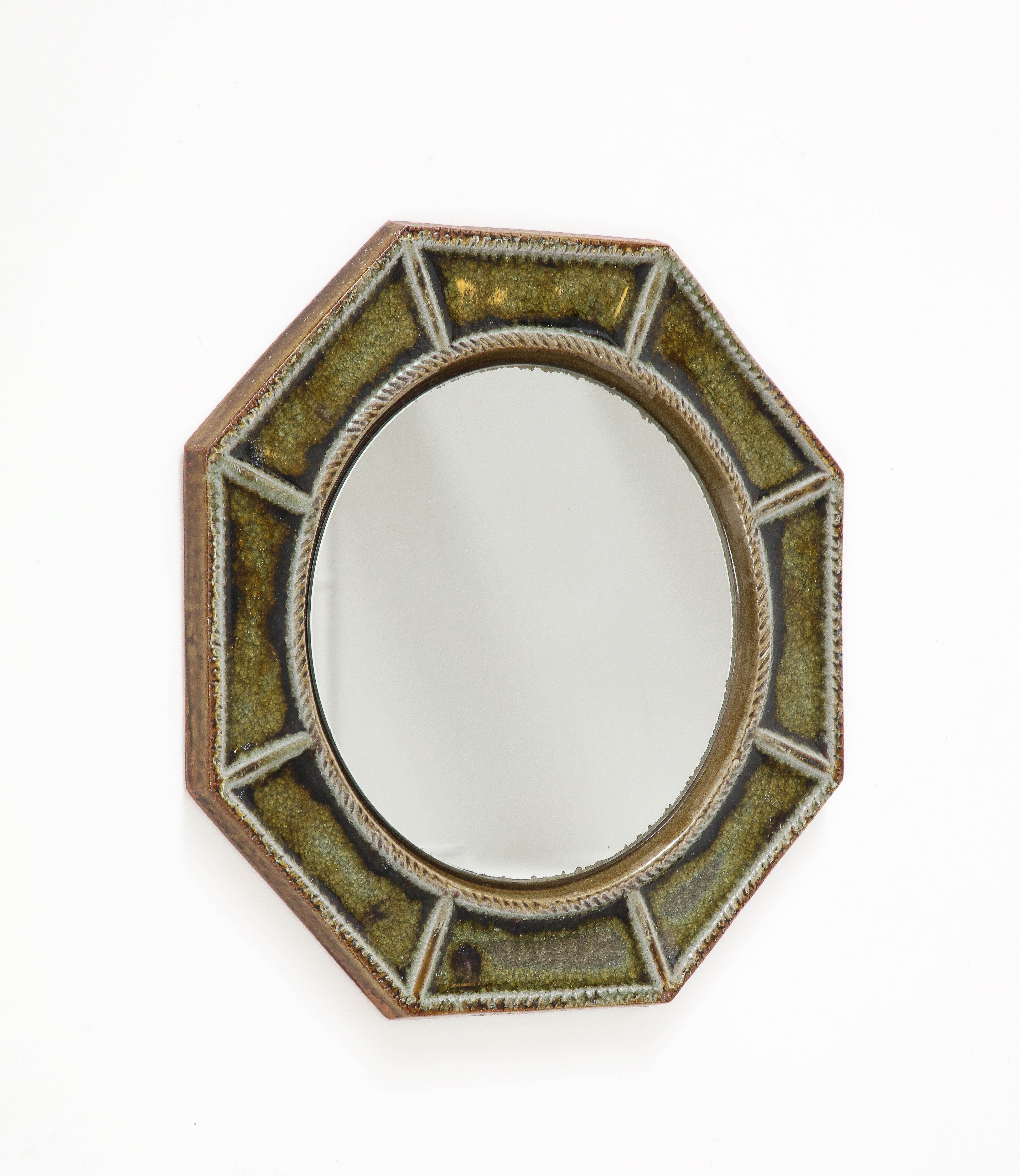 Cloisonné octogonal wall mirror made of glazed green ceramic.
In good vintage condition
France, 1960's
In the style of Vallauris.