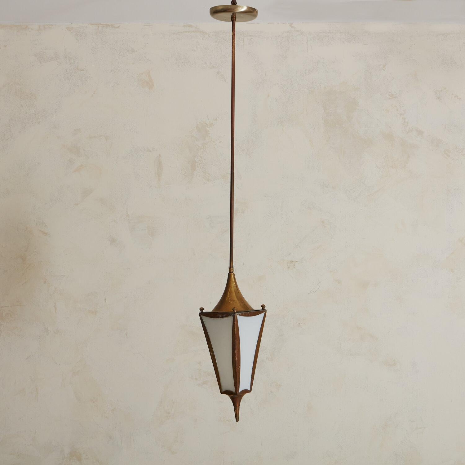 A 1960s Brass Pendant from Northern Italy. Featuring a patinated copper frame with a slightly more modern frame as compared to more commonly found lanterns.

dimensions: 17” H x 5.25” W x 5.25” D; Total height to canopy: 44”; 5.25” diameter