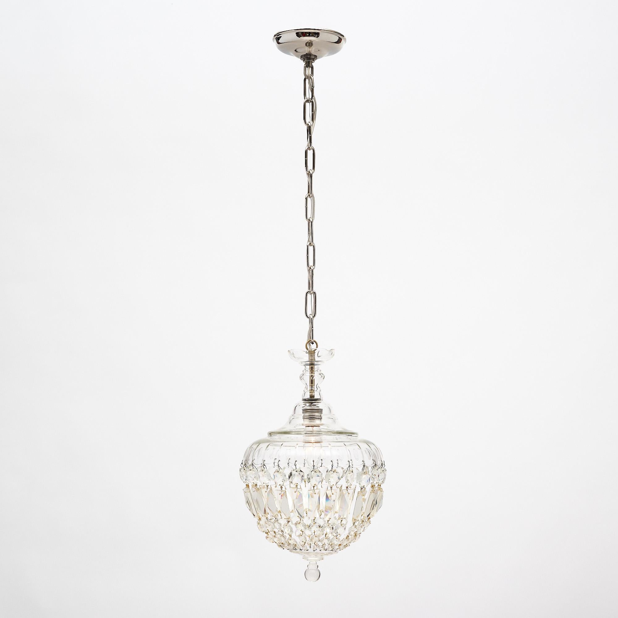 French Pendant fixture by Baccarat. The fixture features a hand engraved bell to which are attached a rich array of crystal cabochons coming together at their bottom to a crystal finial. This fixture has been rewired to fit US standards and is in