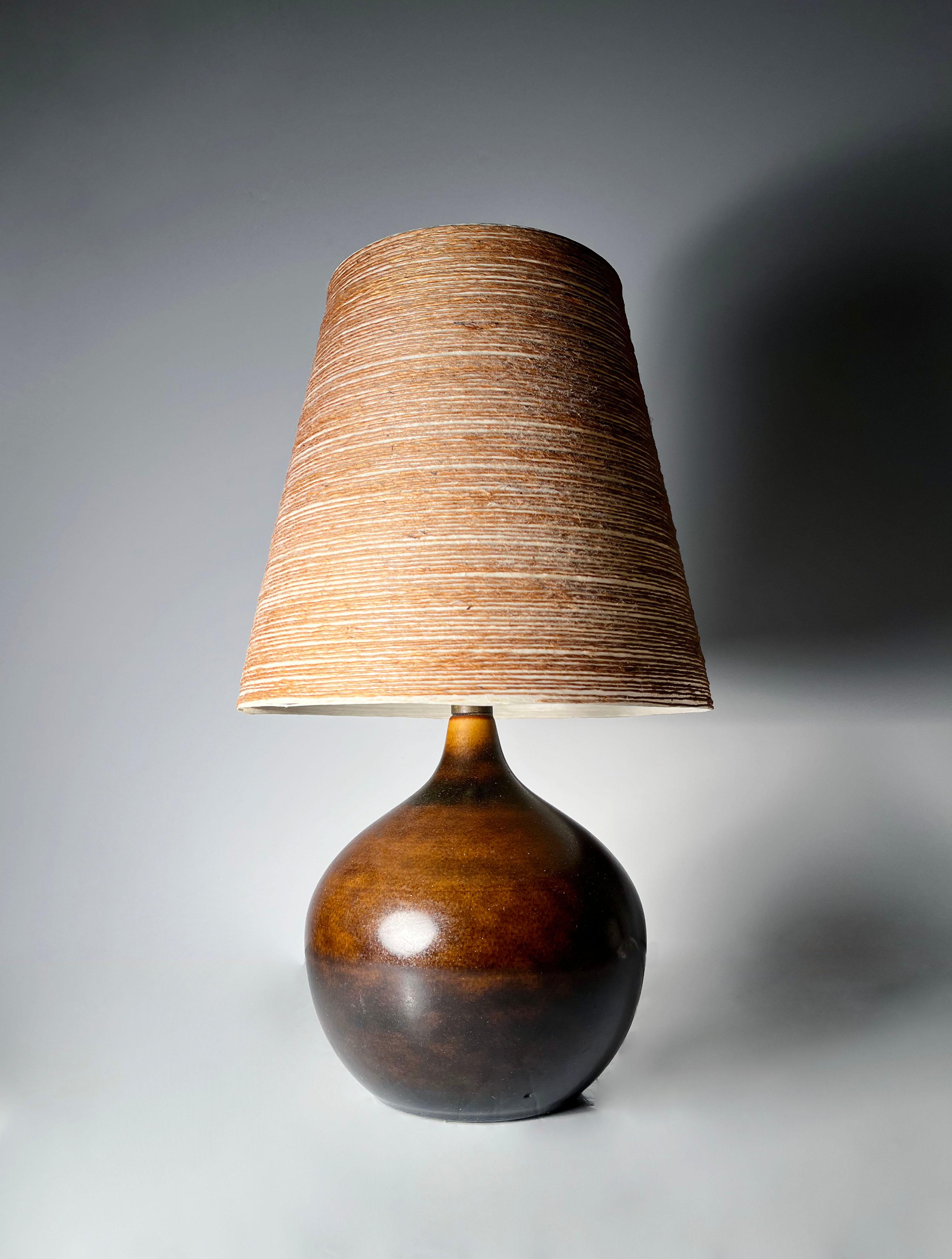 Petite Danish Modern Lotte Bostlund Ceramic Table Lamp. Signed with a label on hardware. Comes with the original Lotte Crafted Shade.

17
