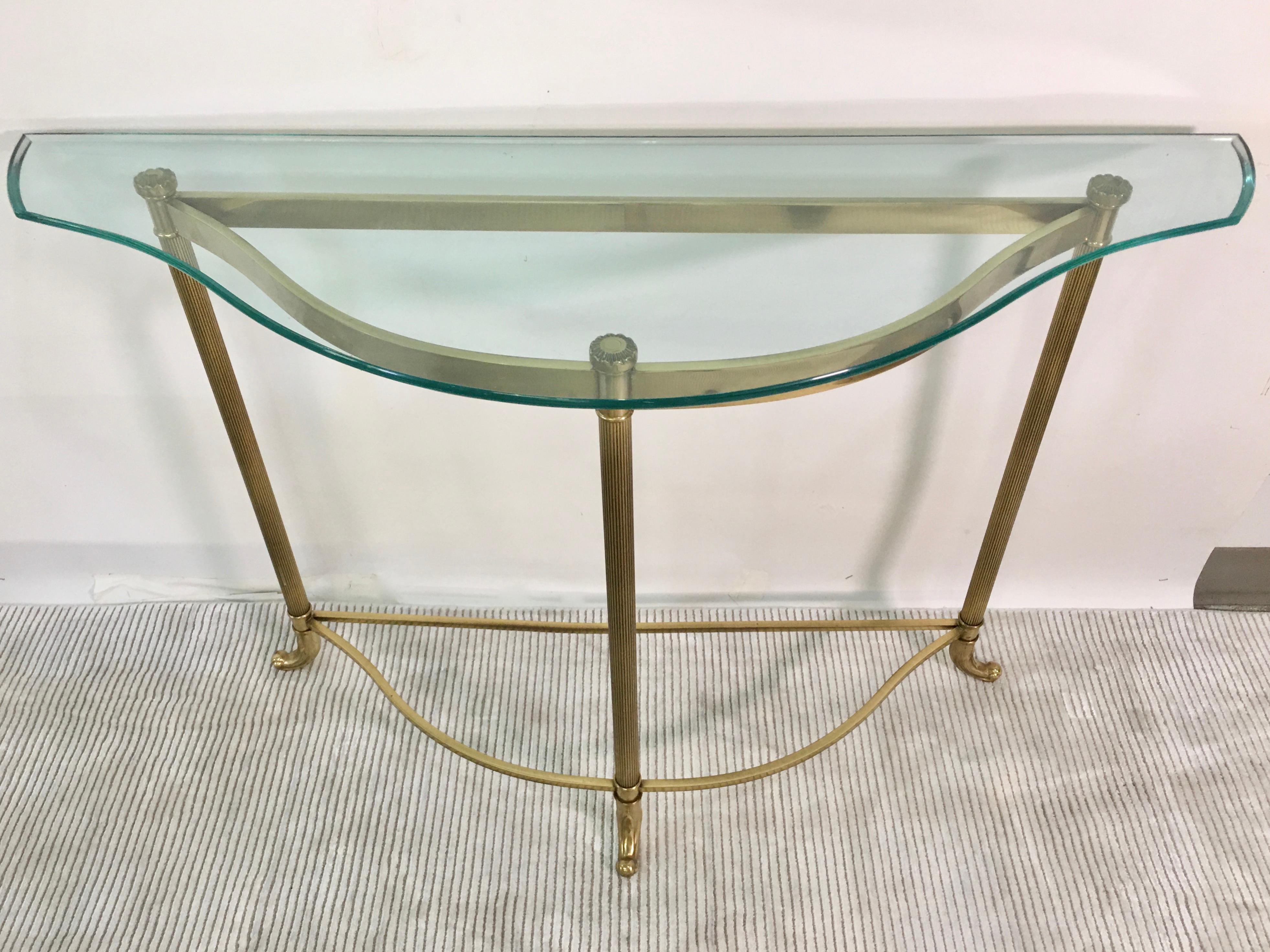 Nicely scaled narrow console table in the shape of Cupid's bow. 
Classic form similar to LaBarge. 
Solid brass verticals and anodized aluminum horizontals with custom florid cut glass top with ogee bevel.

See our separate listing ref: