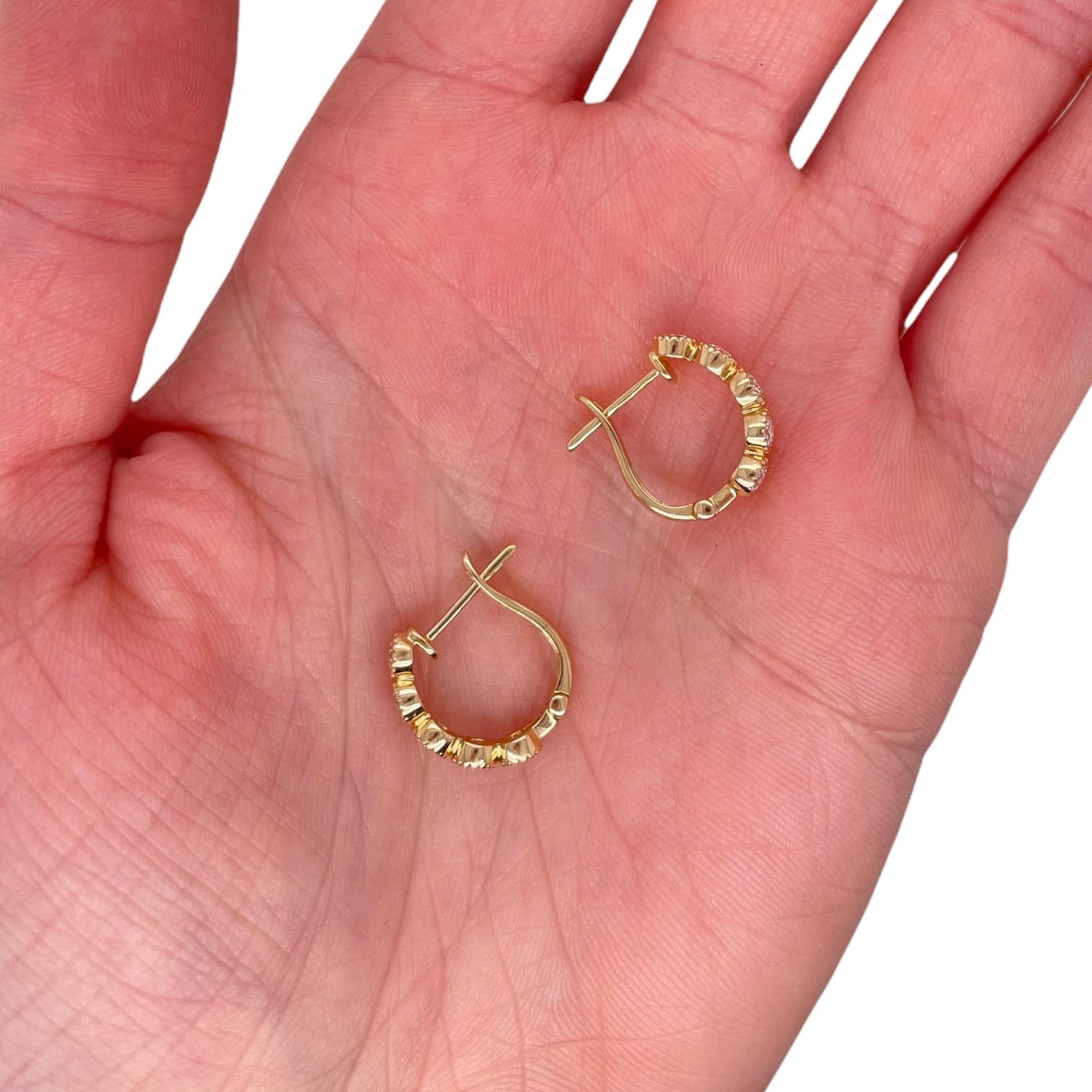 Earring contains 10 round brilliant diamonds totaling 0.72cts. 
Diamonds are G in color and SI1 in clarity, excellent cut. 
Hoop is half an inch in diameter and contains a post back closure.

All of our pieces are packaged carefully and accompanied