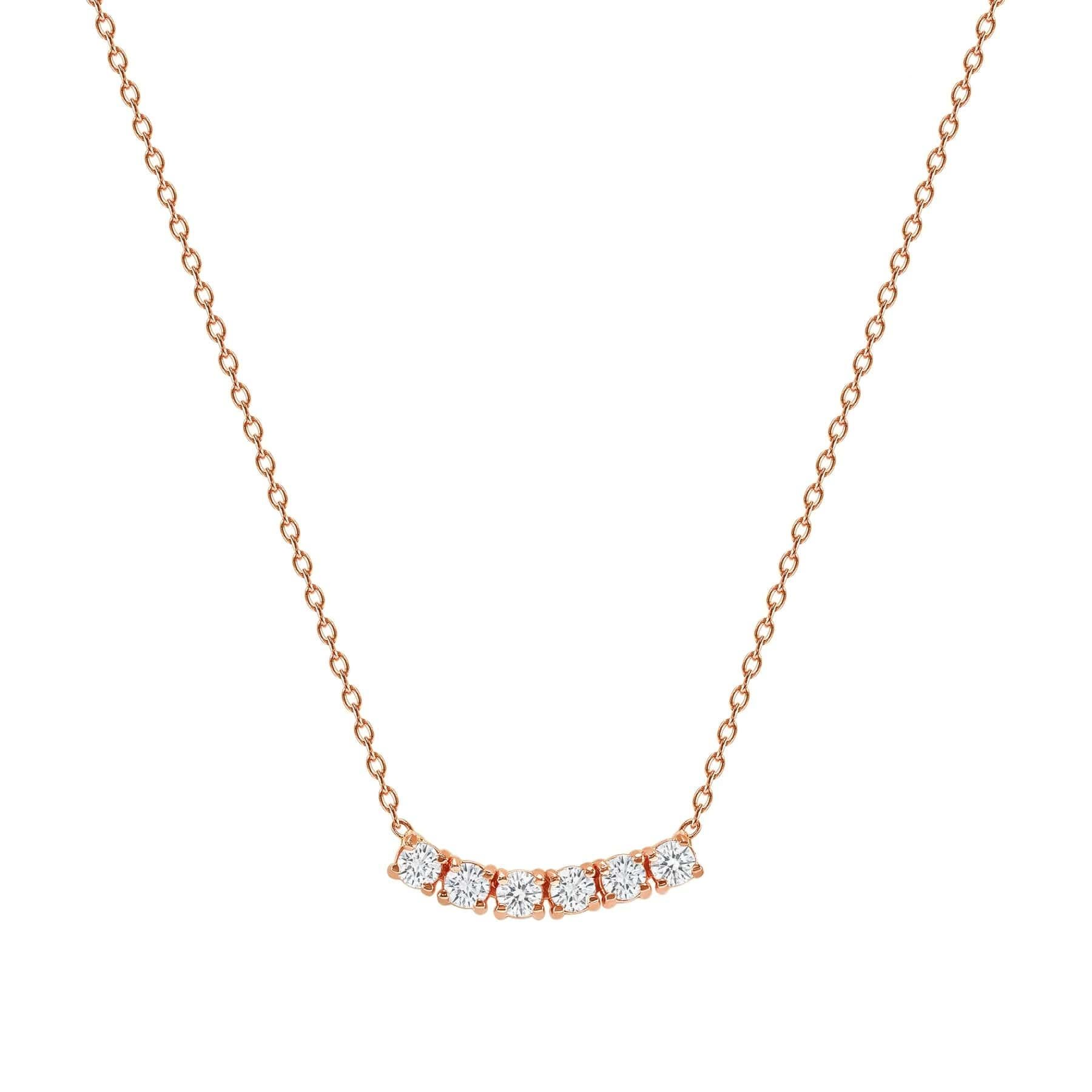 This elegant and timeless necklace features six sparkling diamonds set in a graceful curved design, perfect for adding a touch of sophistication to any look. Crafted in your choice of 14k yellow, rose, or white gold, it’s the ideal piece for