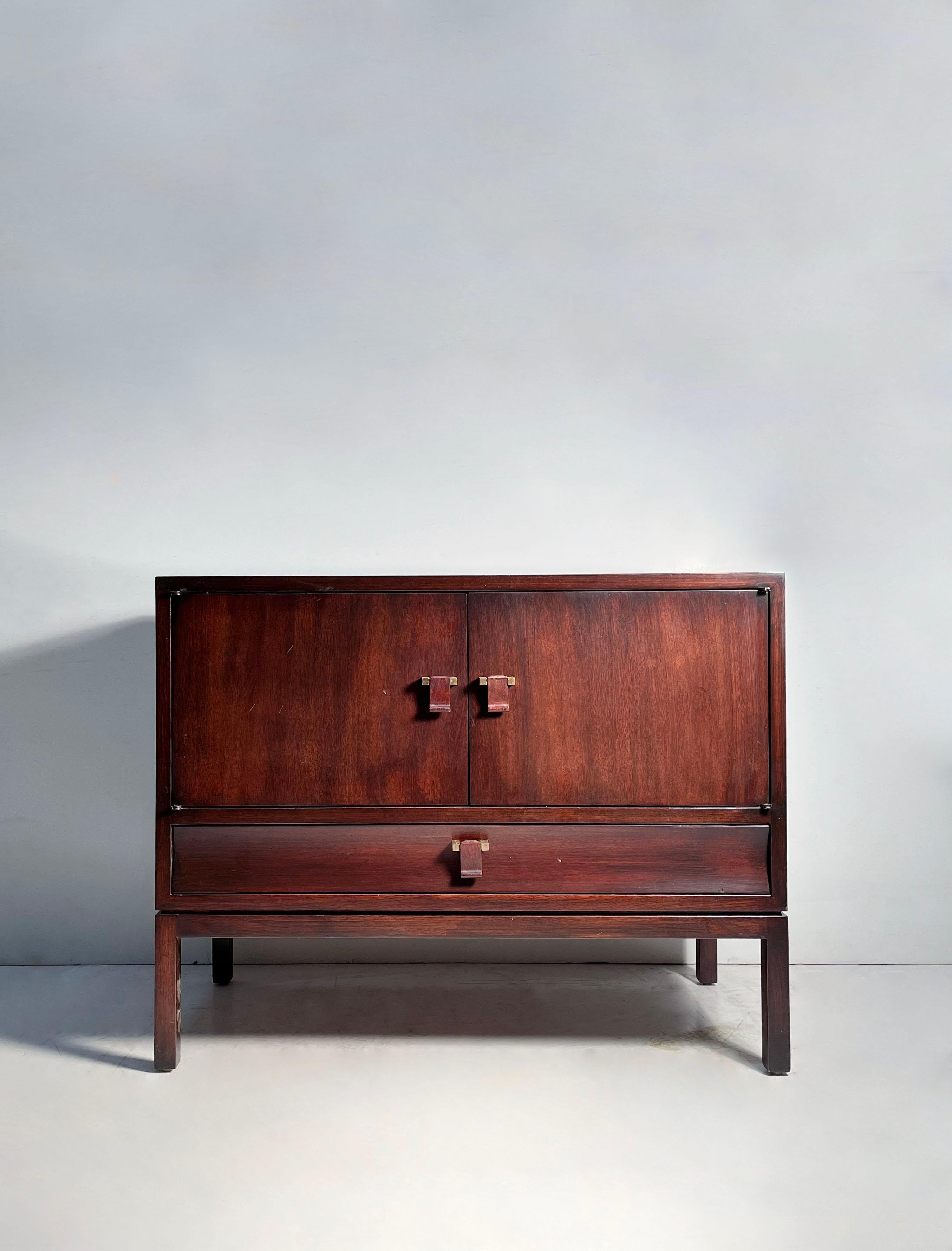 A Petite Dunbar Cabinet by Edward Wormley. Elegant form with wood tab pulls.

Please inquire for additional photos. 