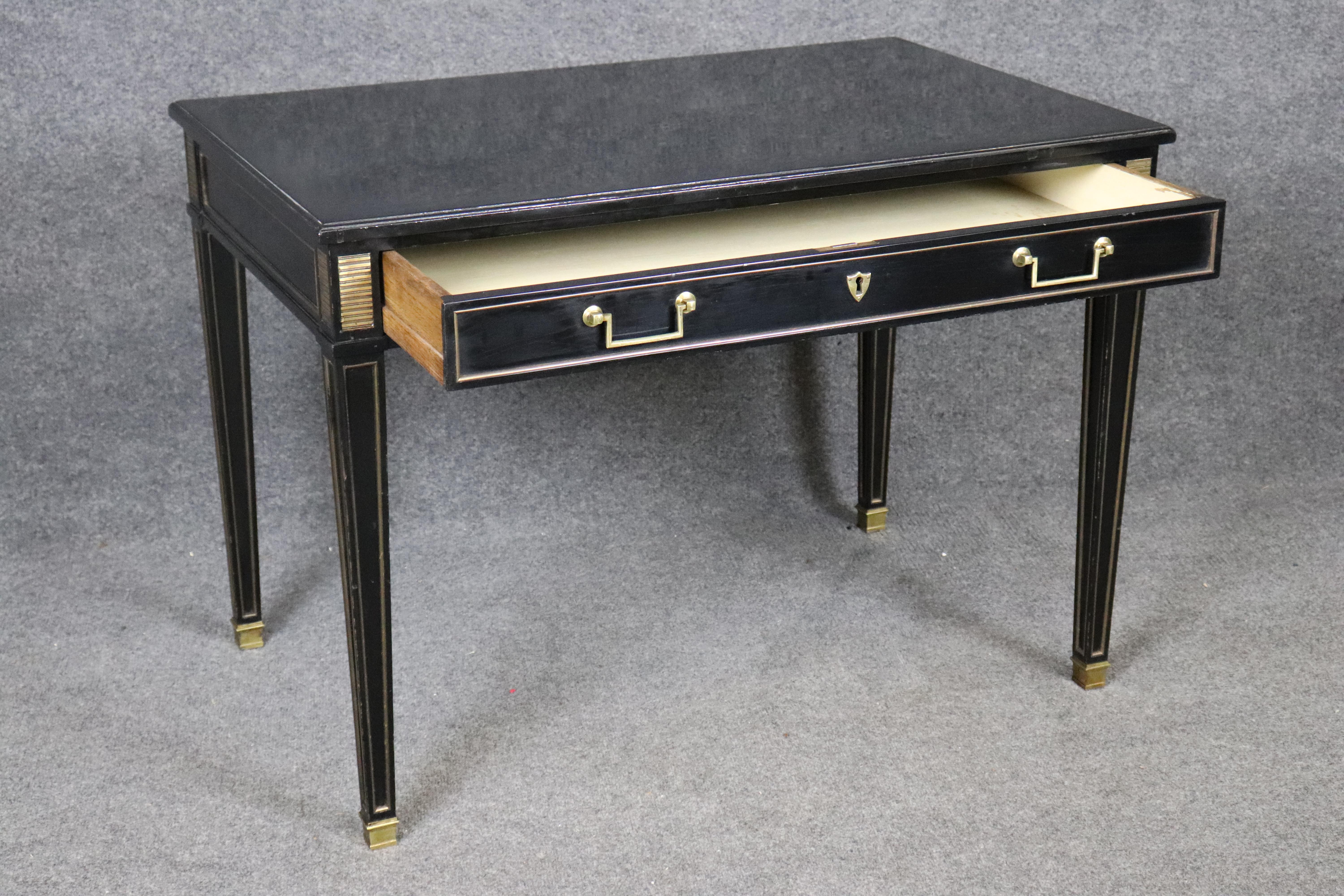 Refined and compact, this Maison Jansen–attributed Directoire-style desk from the 1950s showcases timeless French elegance in a scaled-down form ideal for a lady’s writing table or child’s desk. Expertly ebonized in rich black lacquer, the desk is