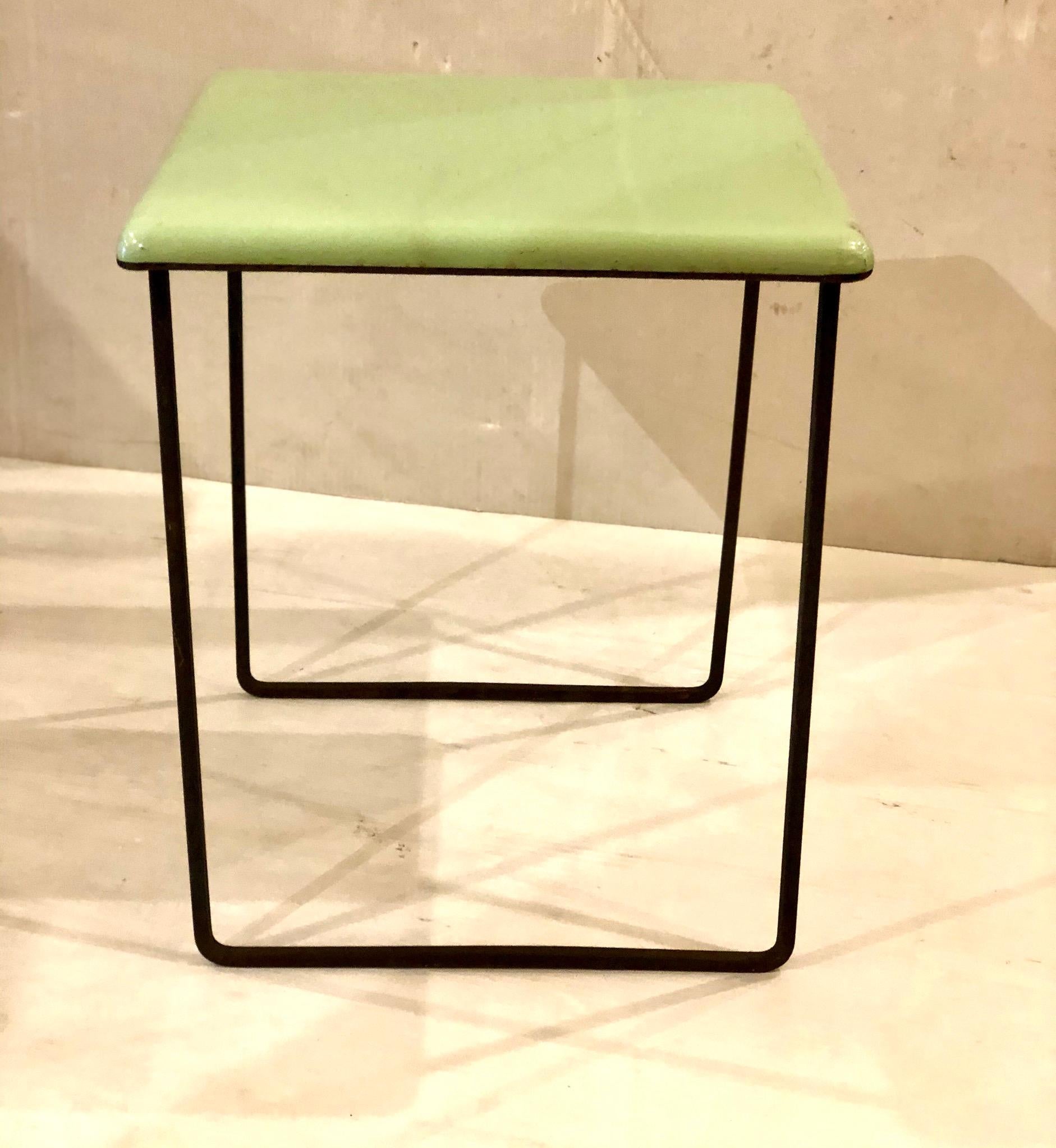 Beautiful pistachio enameled top 1950s small table. Solid iron base the top shows light wear due to age but no chips great unique piece. We left the base in original finish with nice patina.