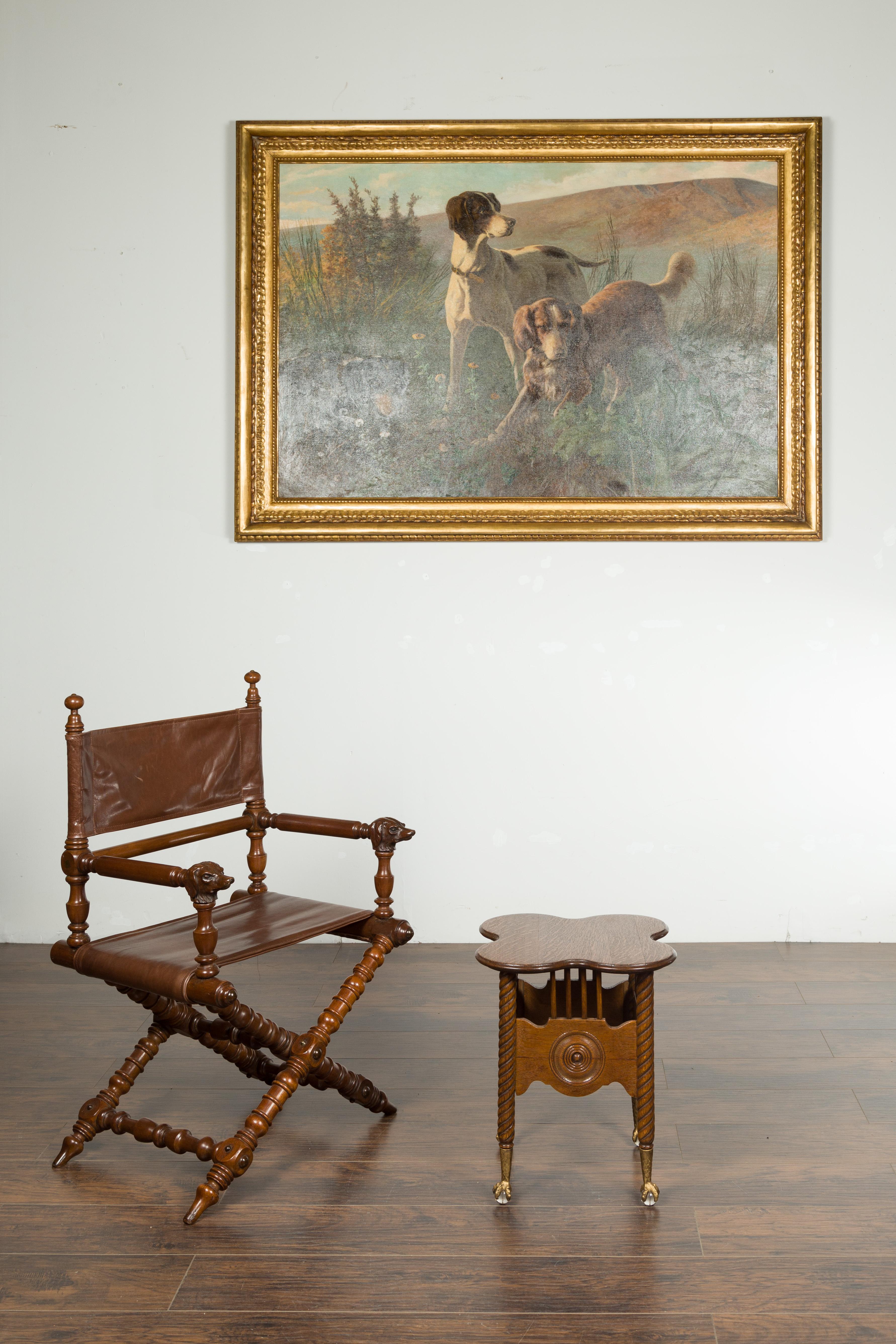 A petite English oak drinks table from the late 19th century, with twisted legs, carved concentric medallions and glass ball and gilt claw feet. Created in England during the last quarter of the 19th century, this petite oak drinks table features a