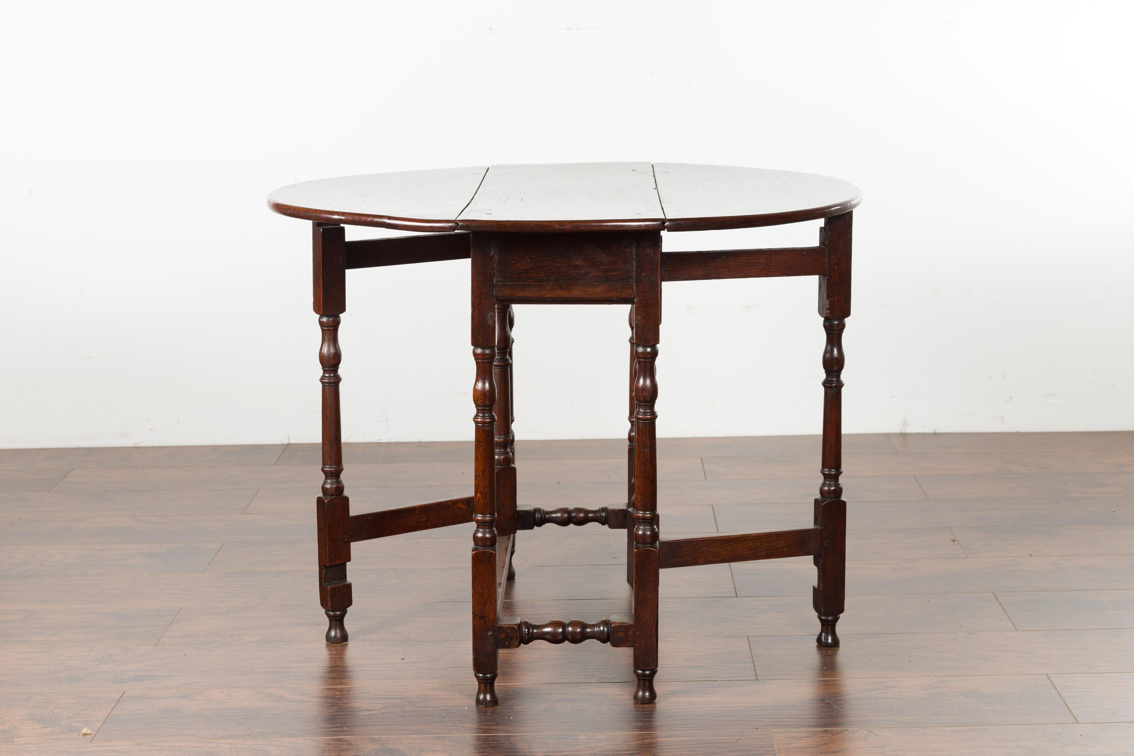 Petite English Oval Oak 19th Century Drop-Leaf Table with Baluster Legs For Sale 7