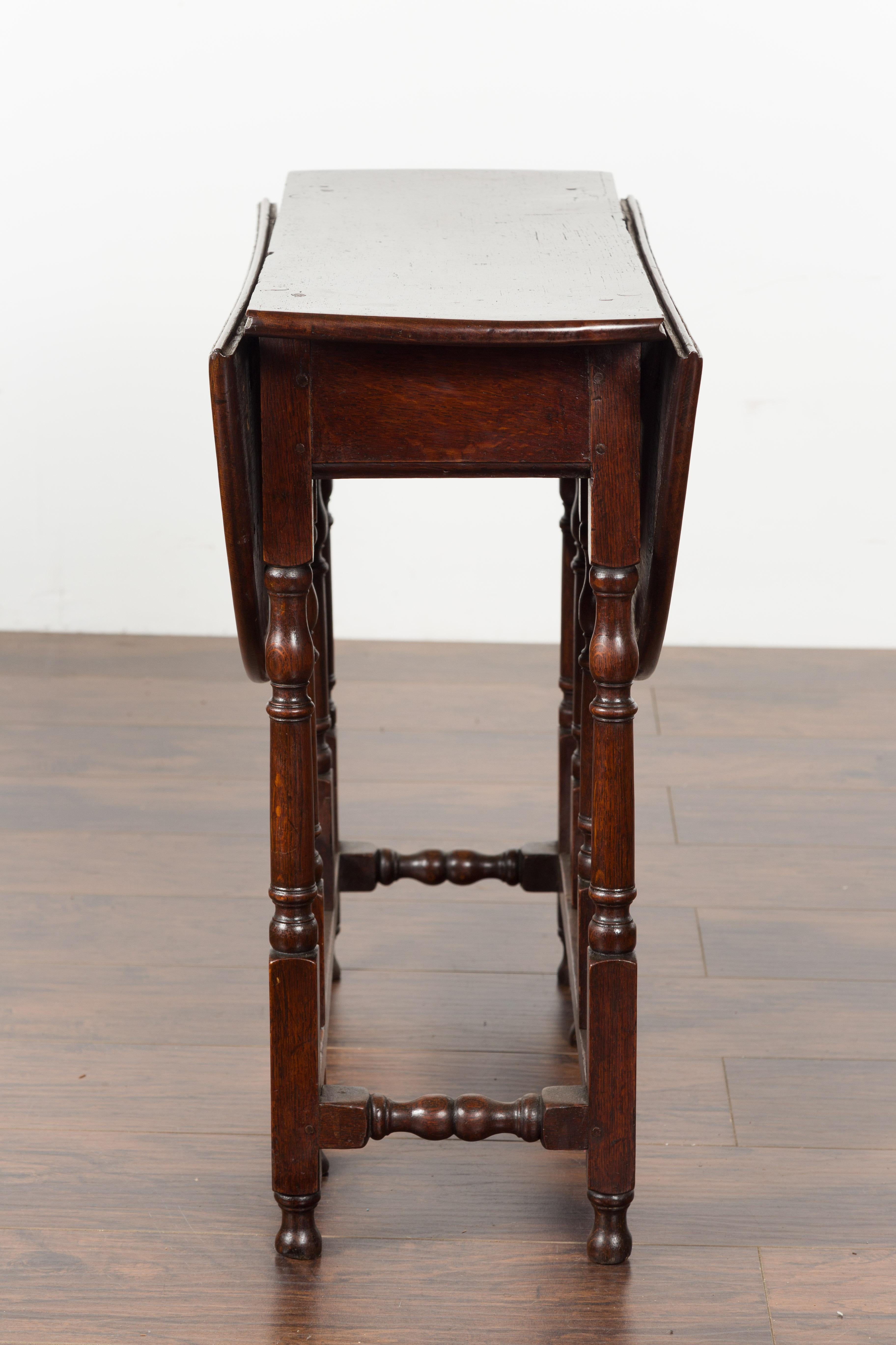 Petite English Oval Oak 19th Century Drop-Leaf Table with Baluster Legs For Sale 12