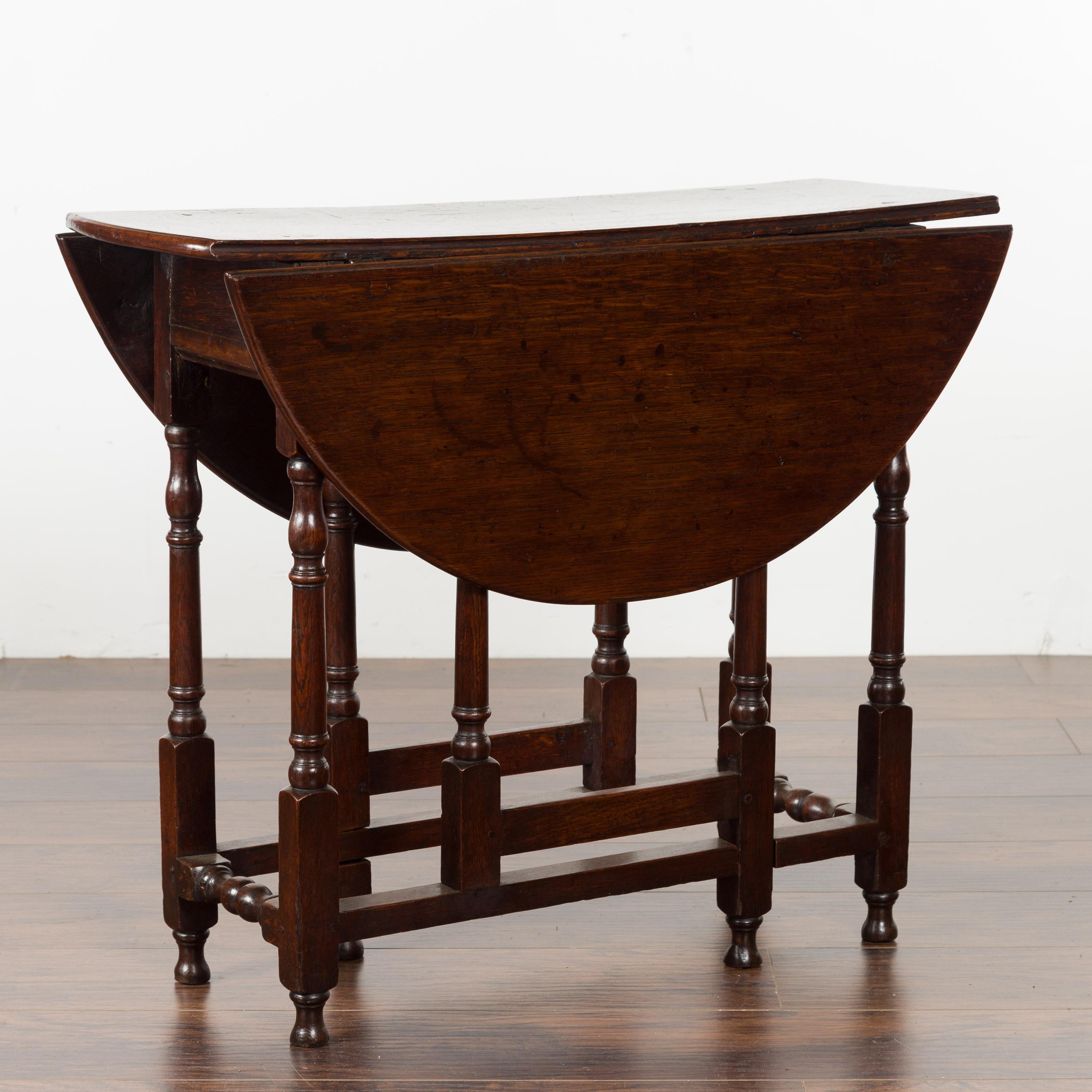 Petite English Oval Oak 19th Century Drop-Leaf Table with Baluster Legs For Sale 2