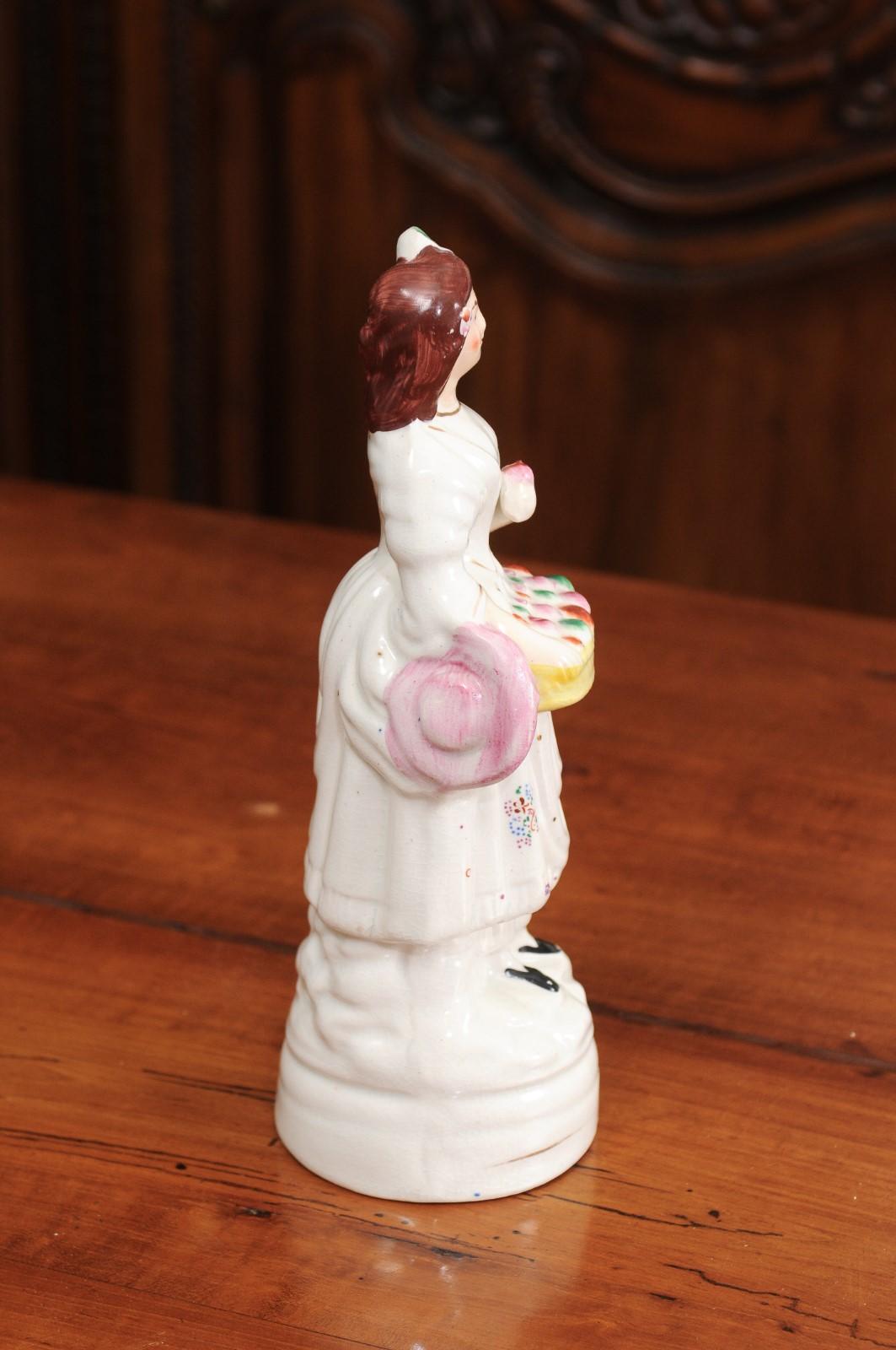 Petite English Porcelain Decorative Object Depicting a Lady with a Floral Basket In Good Condition For Sale In Atlanta, GA