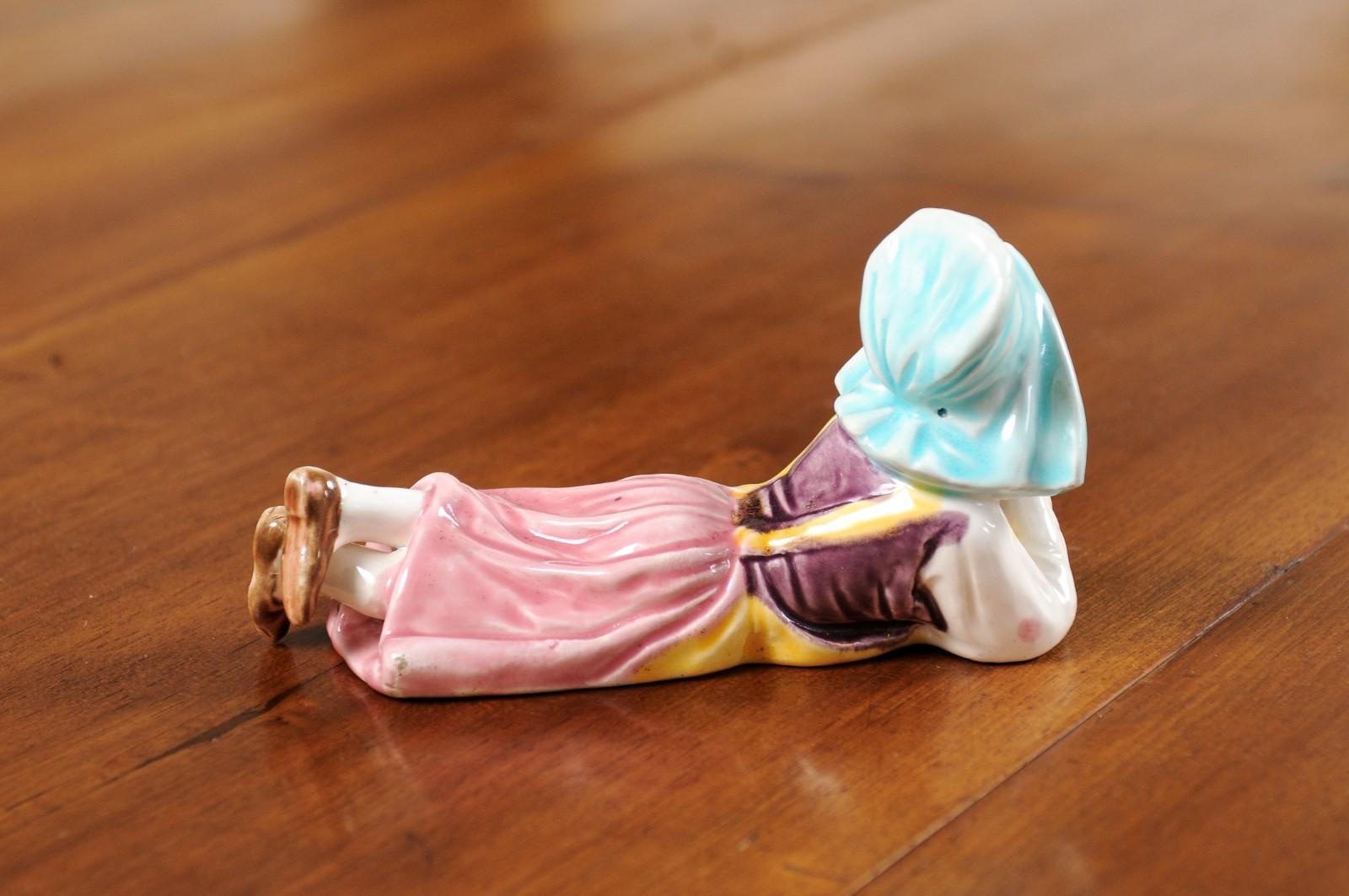 Petite English Porcelain Figurine Depicting a Young Girl Laying on the Ground For Sale 2