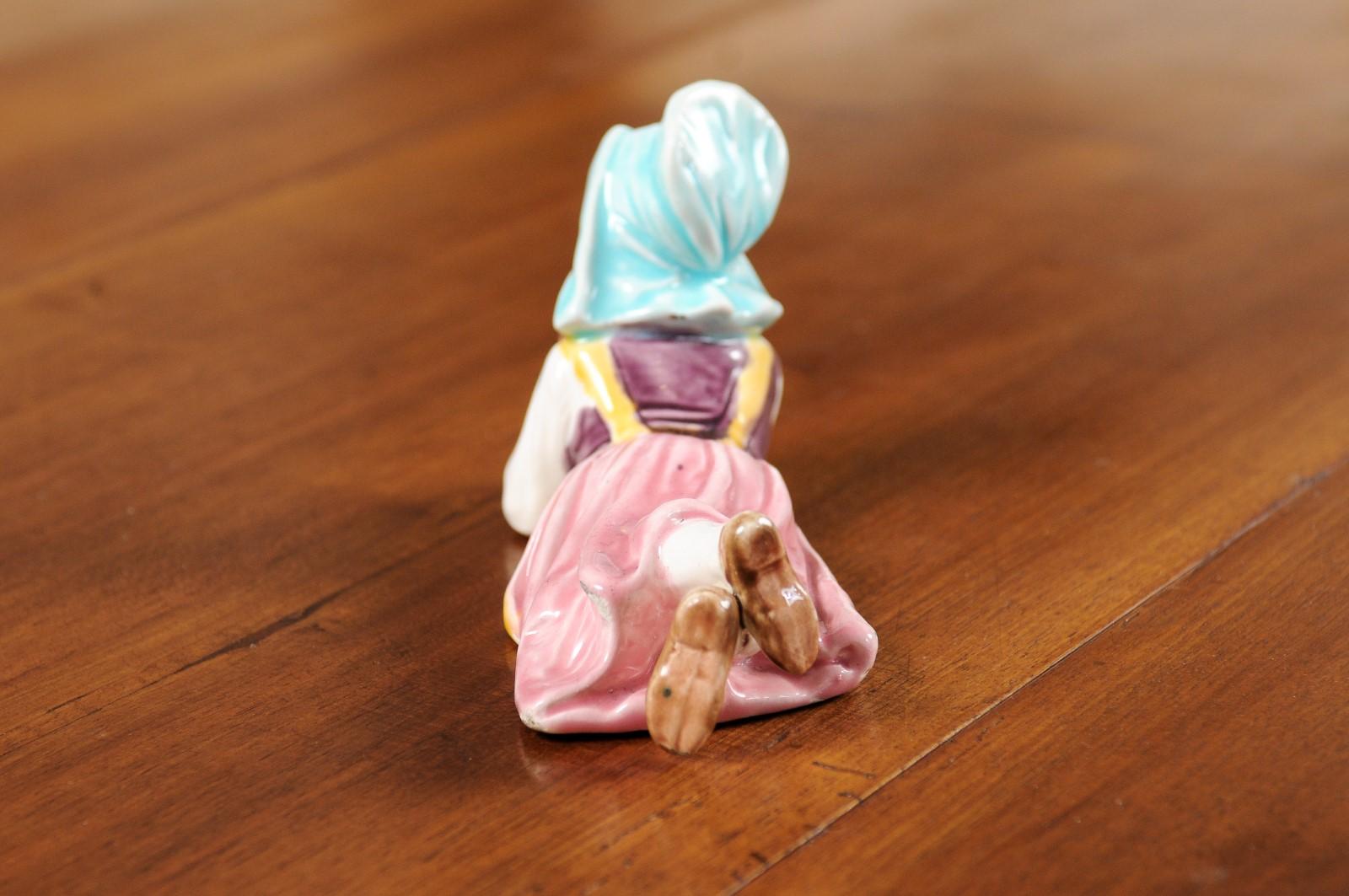 Petite English Porcelain Figurine Depicting a Young Girl Laying on the Ground For Sale 3
