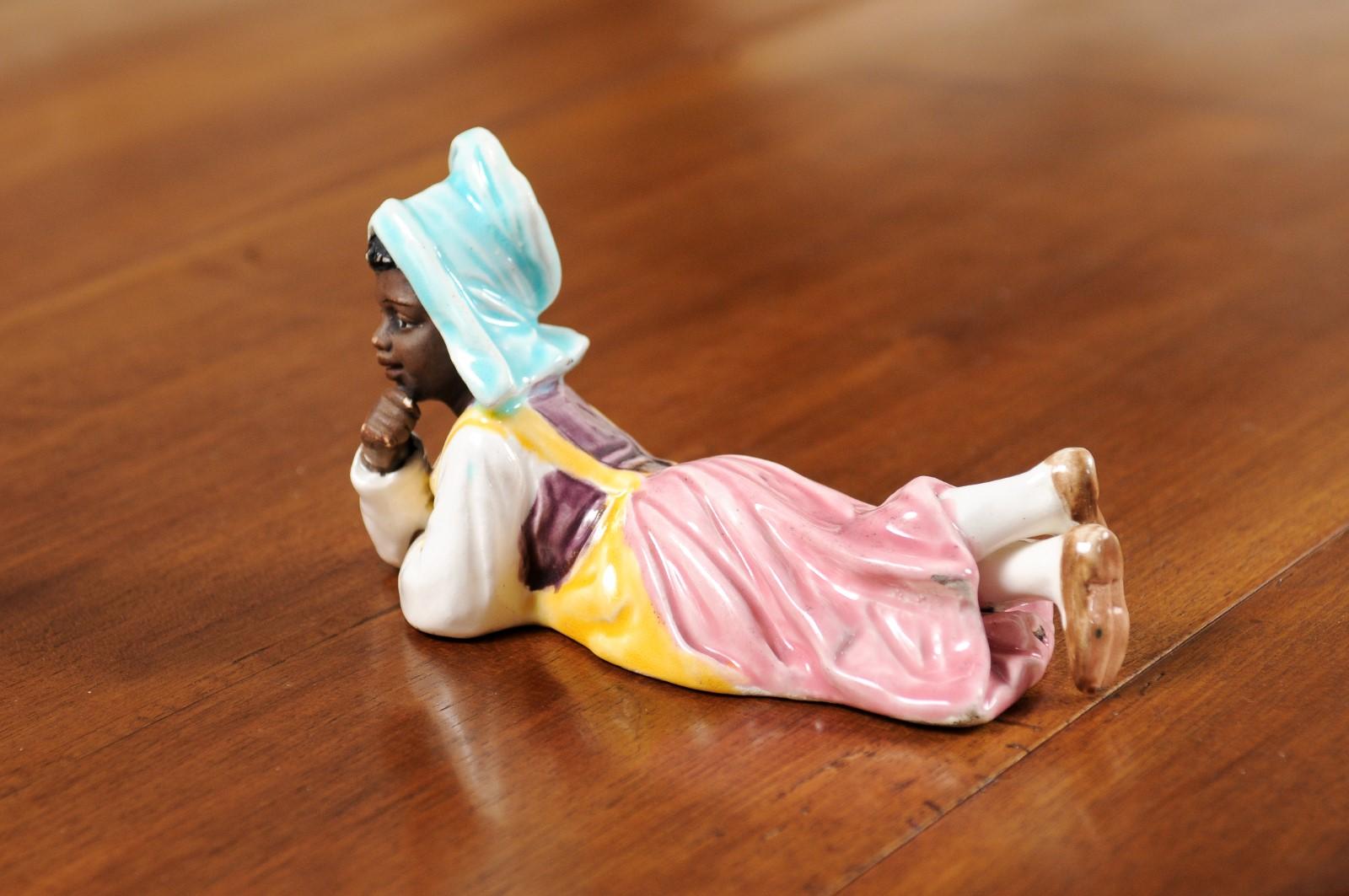 Petite English Porcelain Figurine Depicting a Young Girl Laying on the Ground For Sale 4