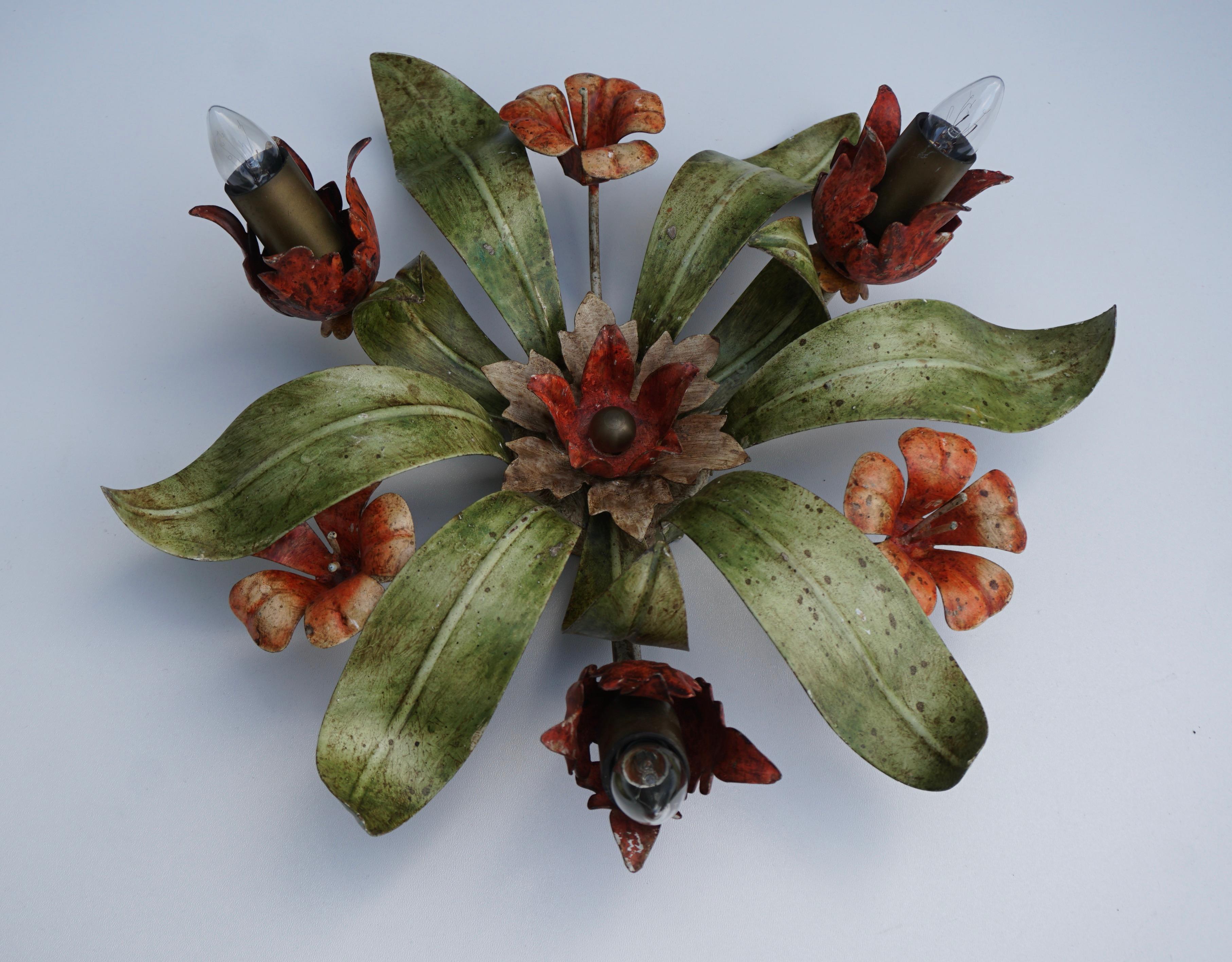 This floral Hollywood Regency or Florentine flush mount is decorated withe red flowers and green leaves. The fixture requires three European E14 / 110 Volt candelabra bulb, up to 60 watts. 

This light fixture can be used as a ceiling light or a