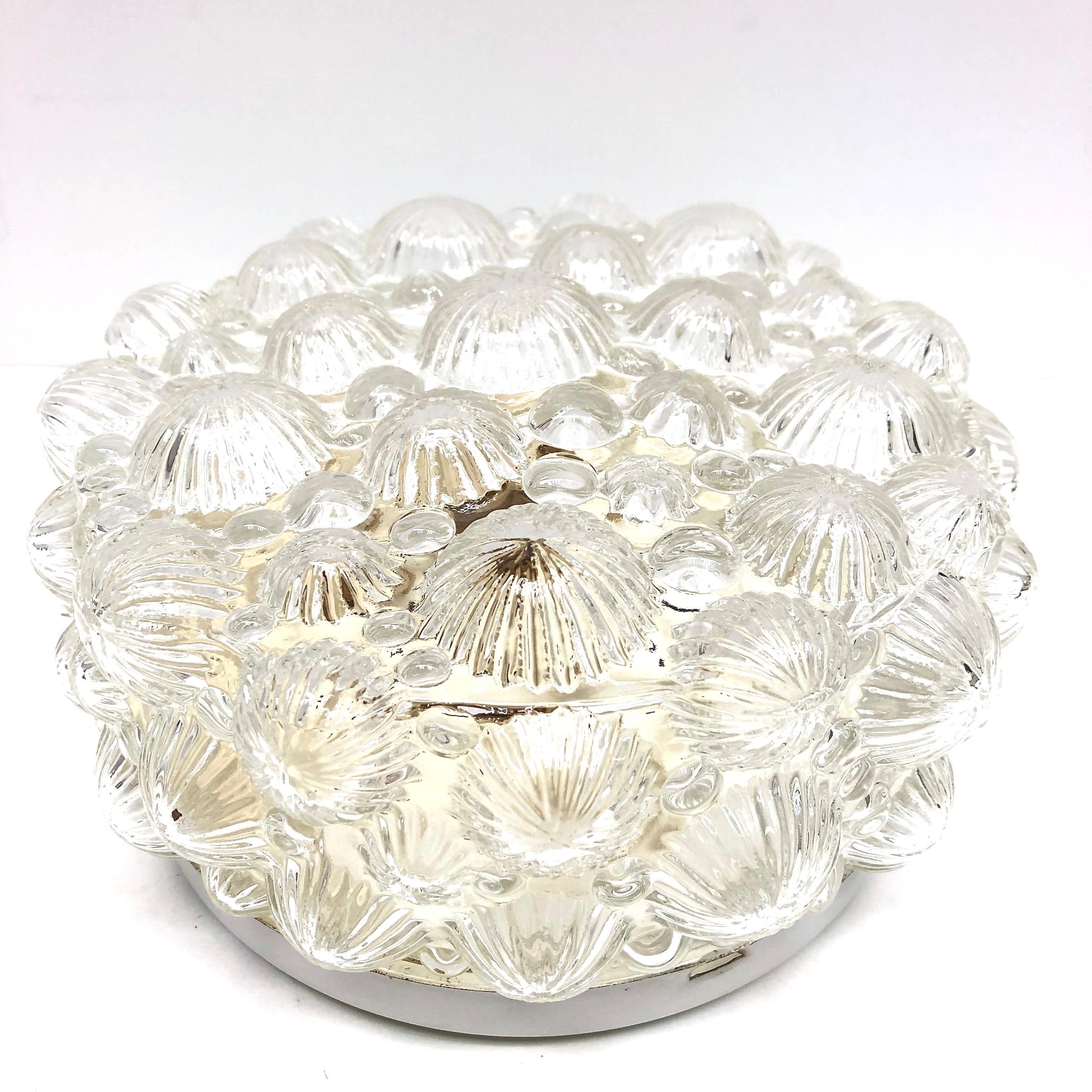 A beautiful flush mount manufactured by RZB Leuchten. It is a clear glass on a metal frame. The fixture requires one European
E27 / 110 Volt Edison bulb, up to 60 watts. Also a nice wall lamp for your entry hall or just a ceiling light.