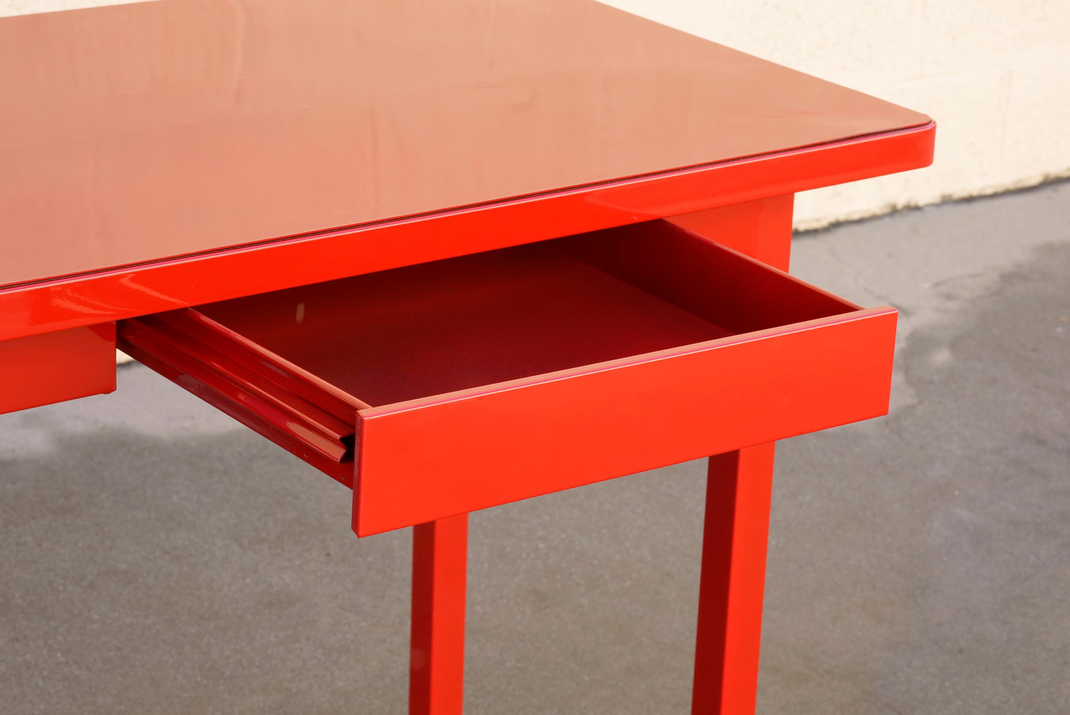 Midcentury four-legged tanker table with drawer, circa 1940s. This unique 