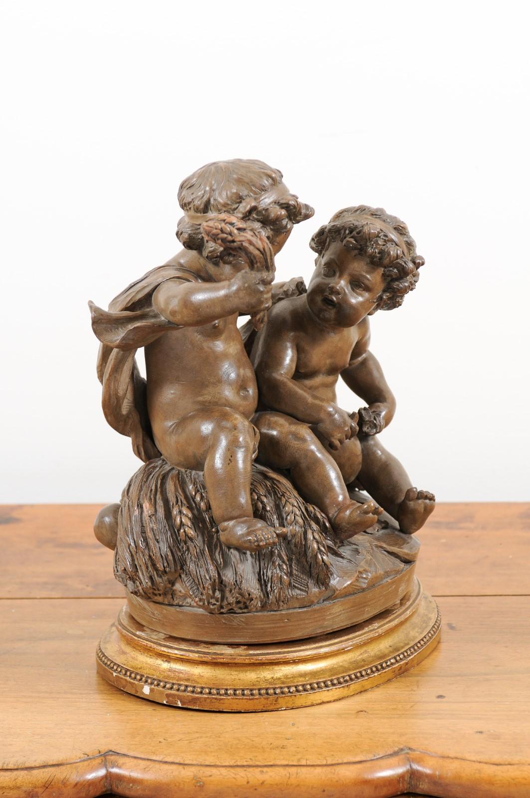 Petite French 1830s Louis-Philippe Terracotta Sculpture of Two Putti on a Base 1
