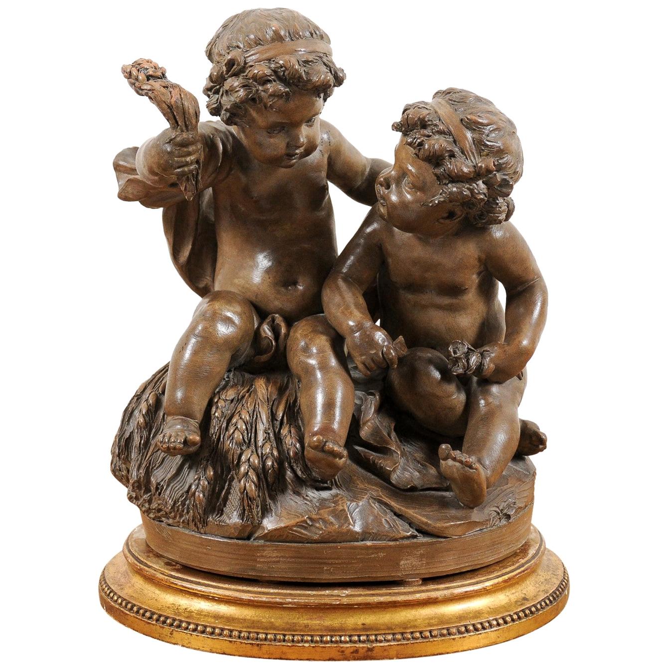 Petite French 1830s Louis-Philippe Terracotta Sculpture of Two Putti on a Base