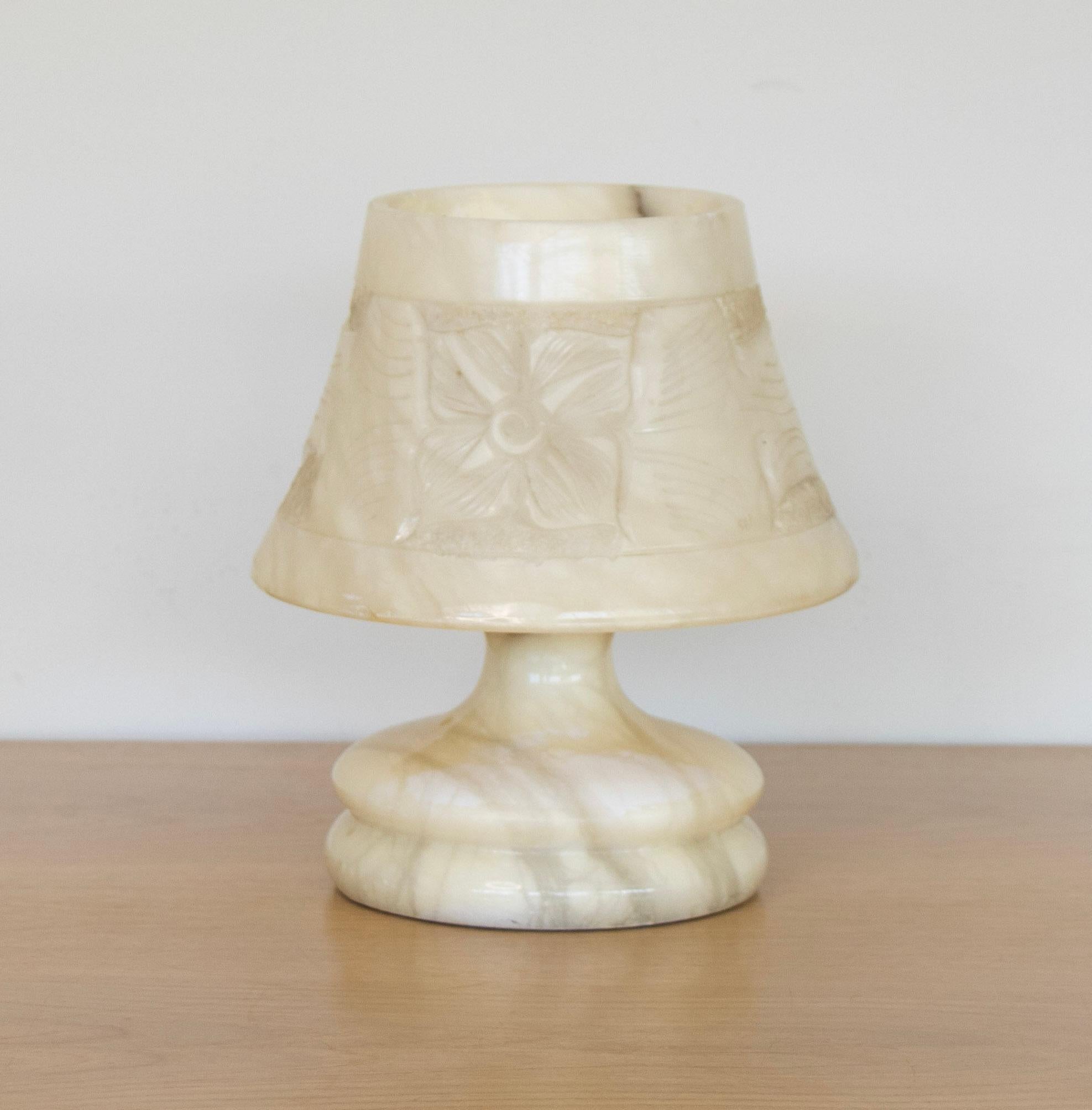 Beautiful petite French alabaster table lamp with carved ribbed base and tapered shade. Stunning intricately carved floral motif on shade. Newly re-wired.