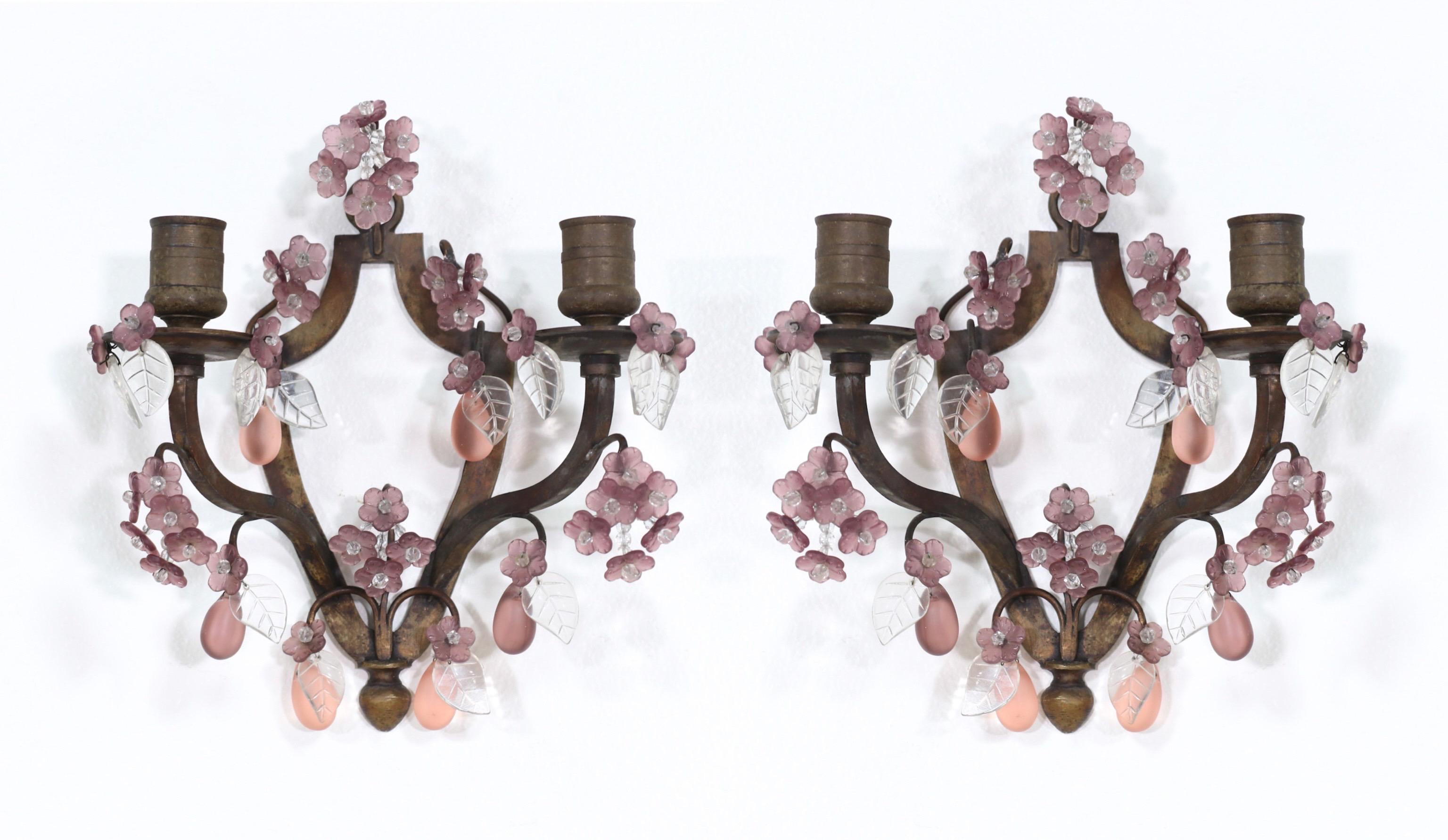 Sweet, petite 1920s French bronze and art glass pair of candle sconces.

Each sconce consists of a shapely bronze frame decorated with tiny light amethyst glass flower, leaves frosted glass droplets.

Incised stamp reads: Made in France.

Each