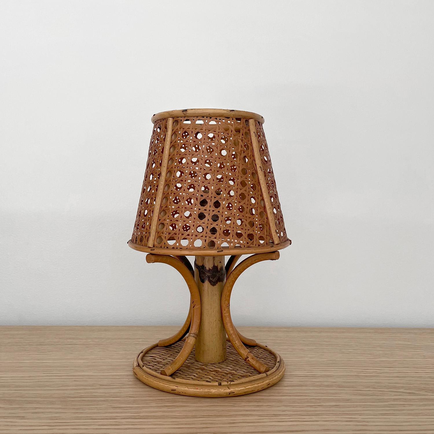 Petite French cane lamp
France, mid century 
Comprised of all natural materials
Cane wrapped shade illuminates light beautifully 
Circular rattan base
Natural color variations 
Patina from age and use
Newly rewired
Single socket candelabra base 


