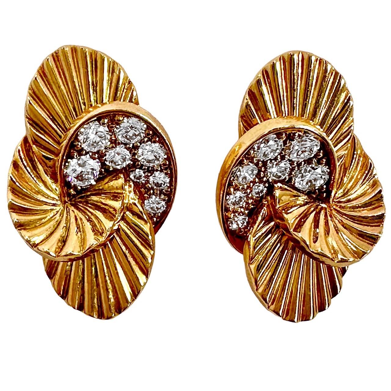 This demure pair of oval shaped, pink gold, French Cartier earrings are precisely crafted pin wheel panels that are set with sixteen brilliant cut diamonds weighing an approximate .65ct total of overall F color and VS1 clarity. They are petite in