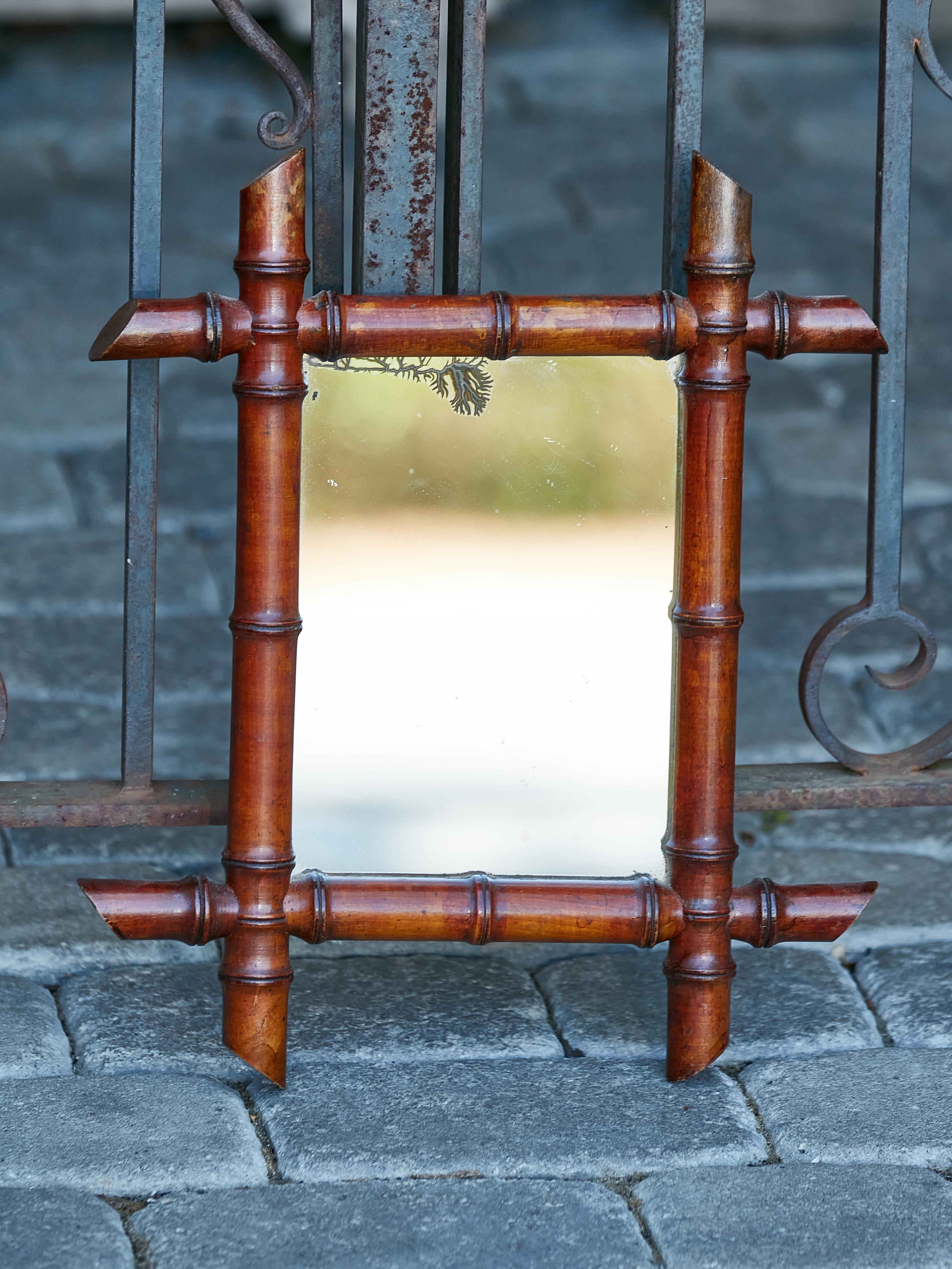 Rustic Petite French Faux Bamboo Walnut Mirror circa 1920 with Slanted Accents For Sale
