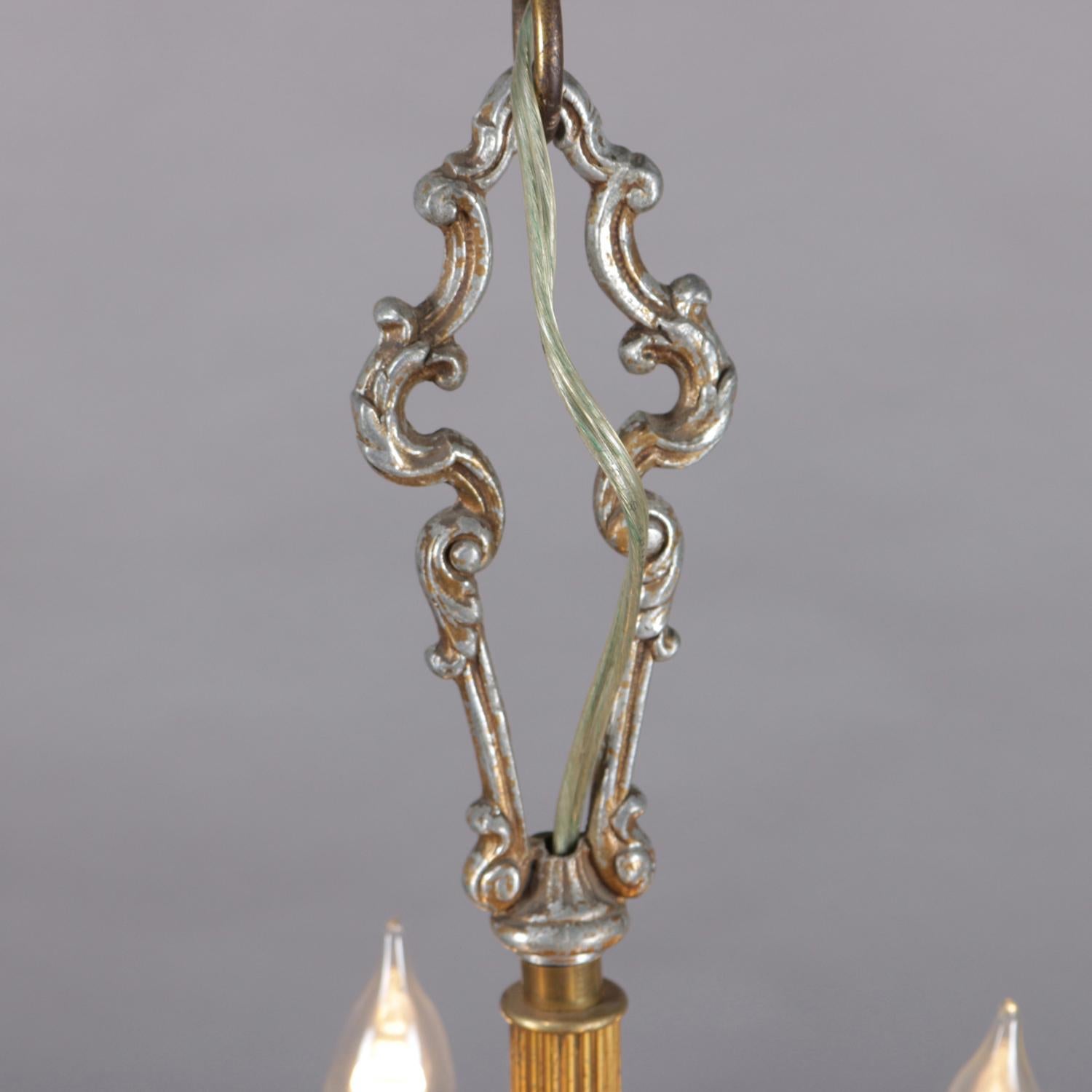A petite French chandelier features gilt frame with reeded column having four arms terminating in candle lights, professionally rewired, 20th century.

***DELIVERY NOTICE – Due to COVID-19 we are employing NO-CONTACT PRACTICES in the transfer of