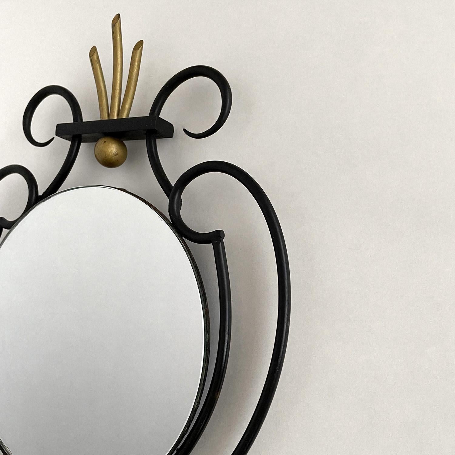 Petite French iron mirror
France, circa 1950s
Hand sculpted iron frame with wonderful brass toned accents
Equal parts charming and delightful, this piece is all about the details
This mirror will bring a smile to anyone who encounters