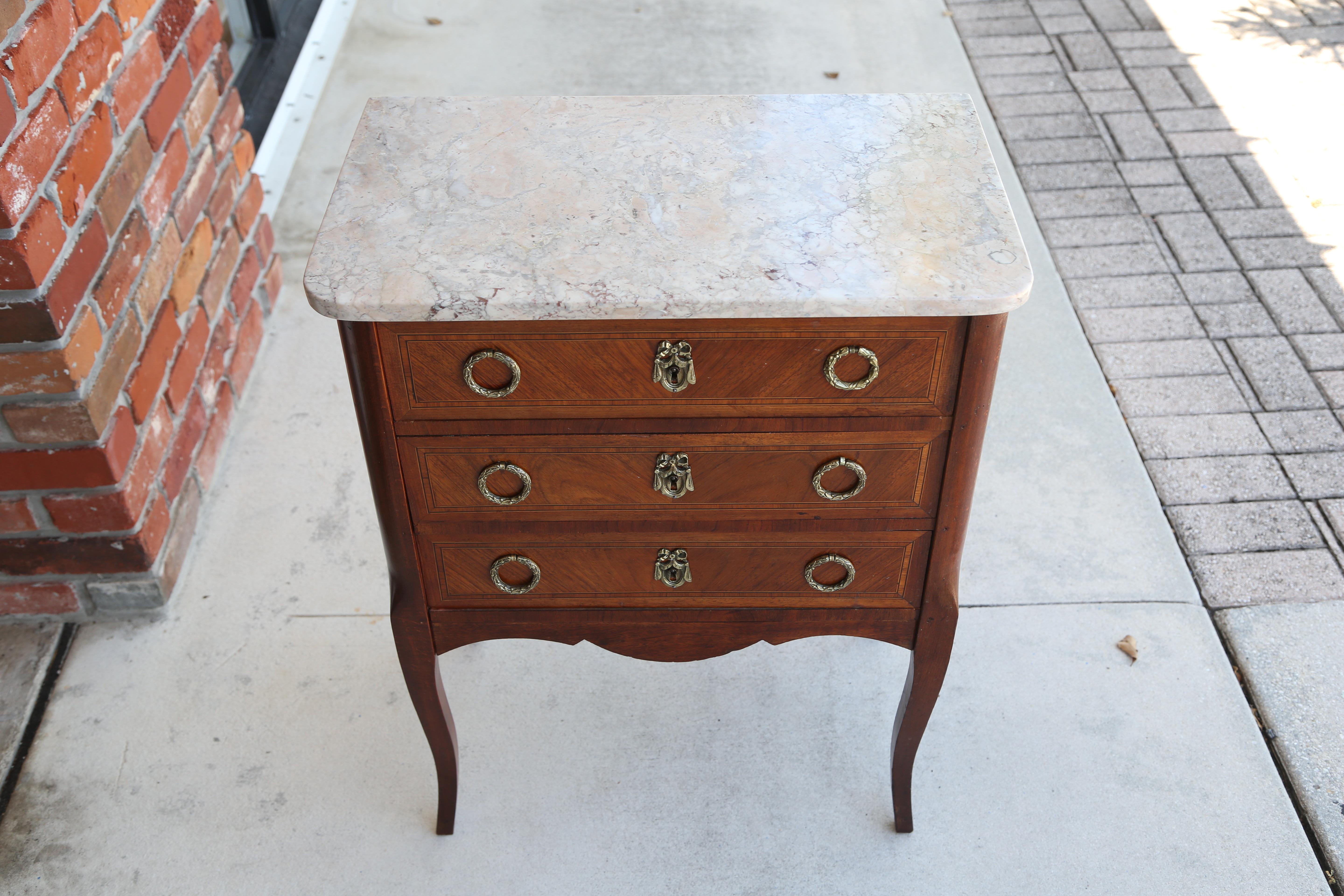 Three-drawer petite French commode with marble top.