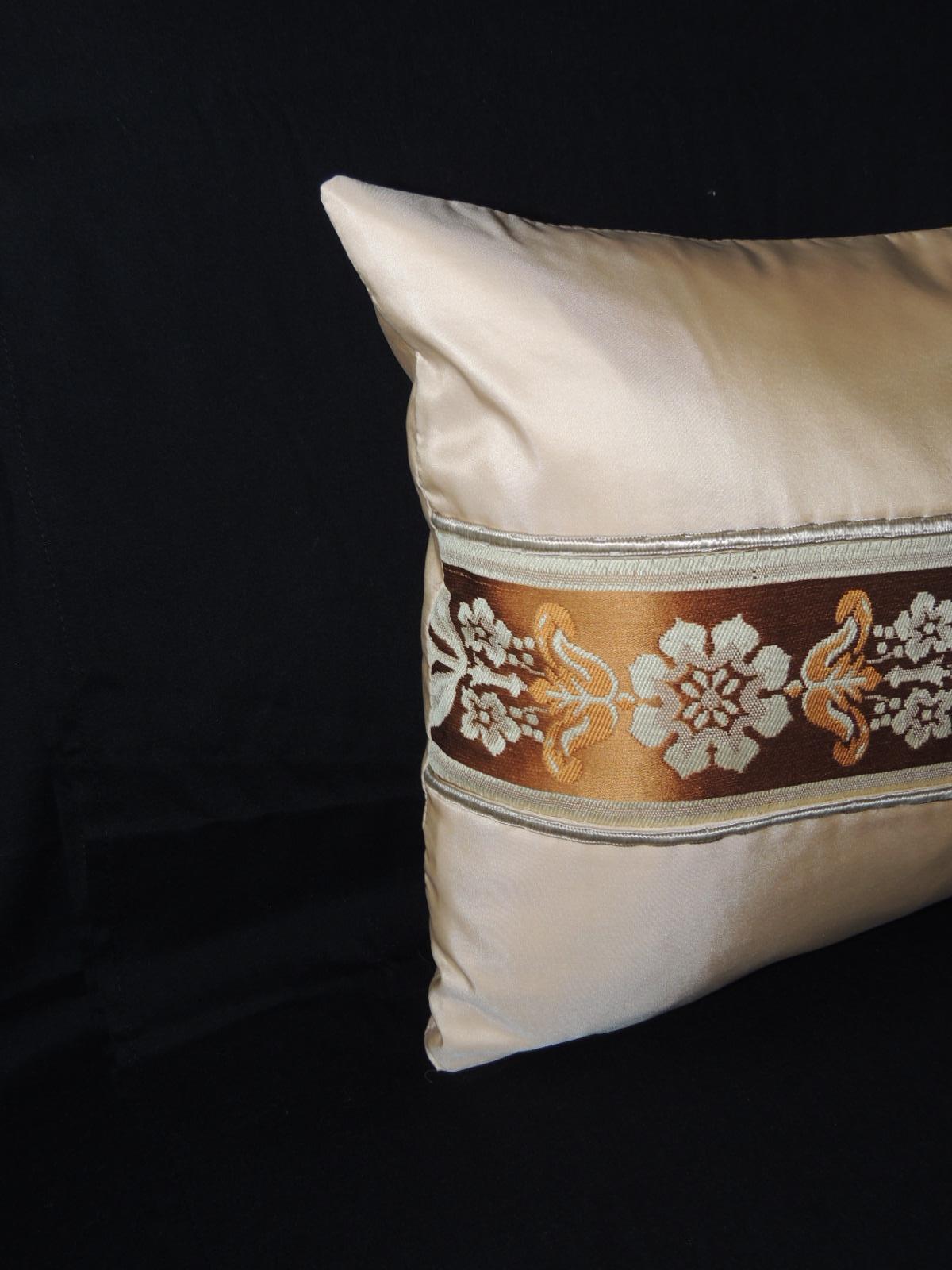 French silk ribbon lumbar decorative pillow handmade by adding a silk woven ribbon onto silk and for embellishment the ribbon has been framed by a peach color vintage silk textile and bordered with an antique silk metallic trim. This decorative