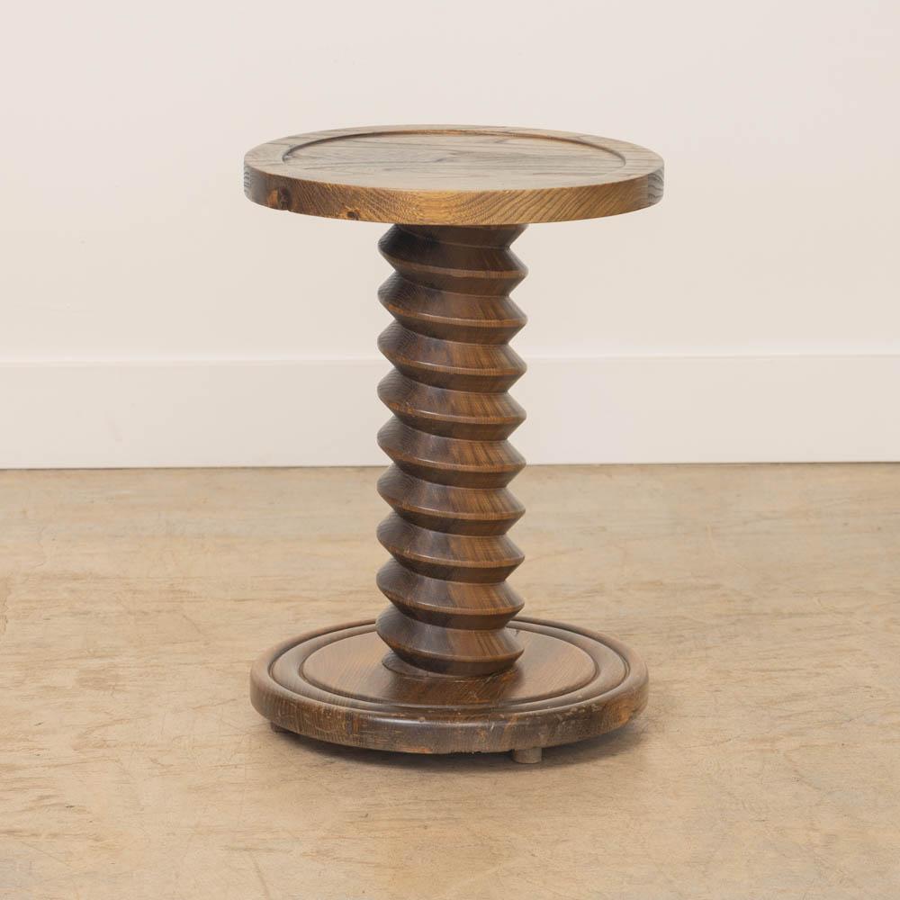 Petite French twisted wood pedestal table with circular top and base. Original wood finish shows natural grain and patina. Perfect drink table between two chairs. 

